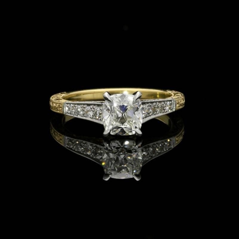 1.07 carat I VS2 old mine cut diamond with GIA certificate
18 Carat yellow gold and platinum with maker's mark and London assay marks
UK finger size M, US size 6.5
4.2 grams

A charming cushion cut diamond ring by Hancocks, centred on a beautiful