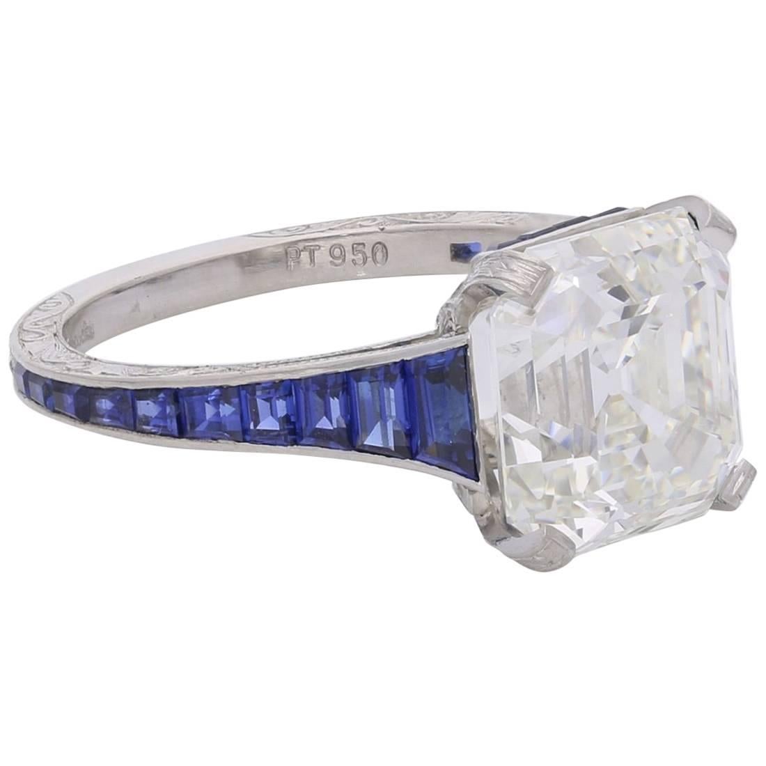 Hancocks 5.03 Carat Asscher Cut Diamond Ring with Tapering Calibre Set Sapphire