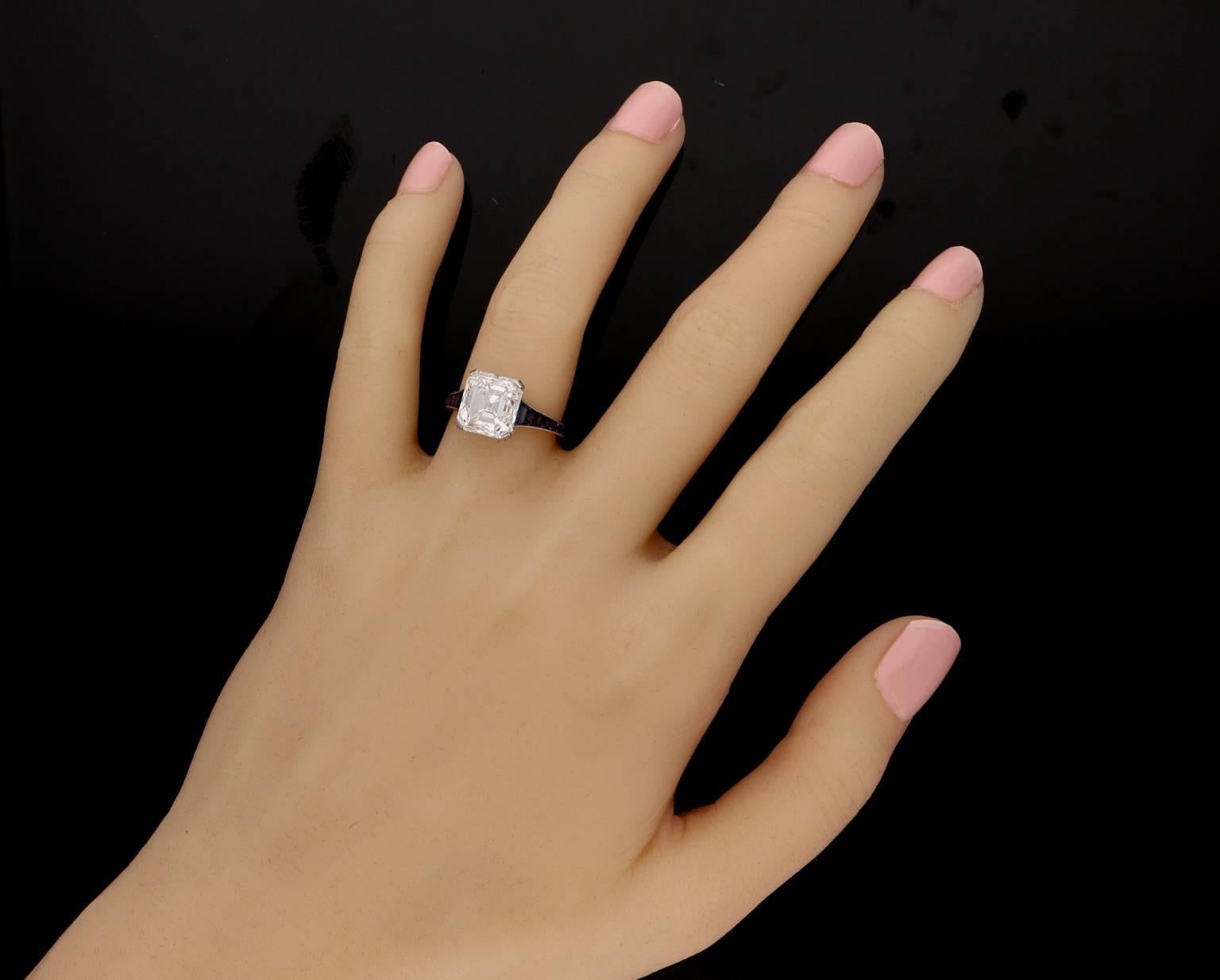 Contemporary Hancocks 5.03 Carat Asscher Cut Diamond Ring with Tapering Calibre Set Sapphire