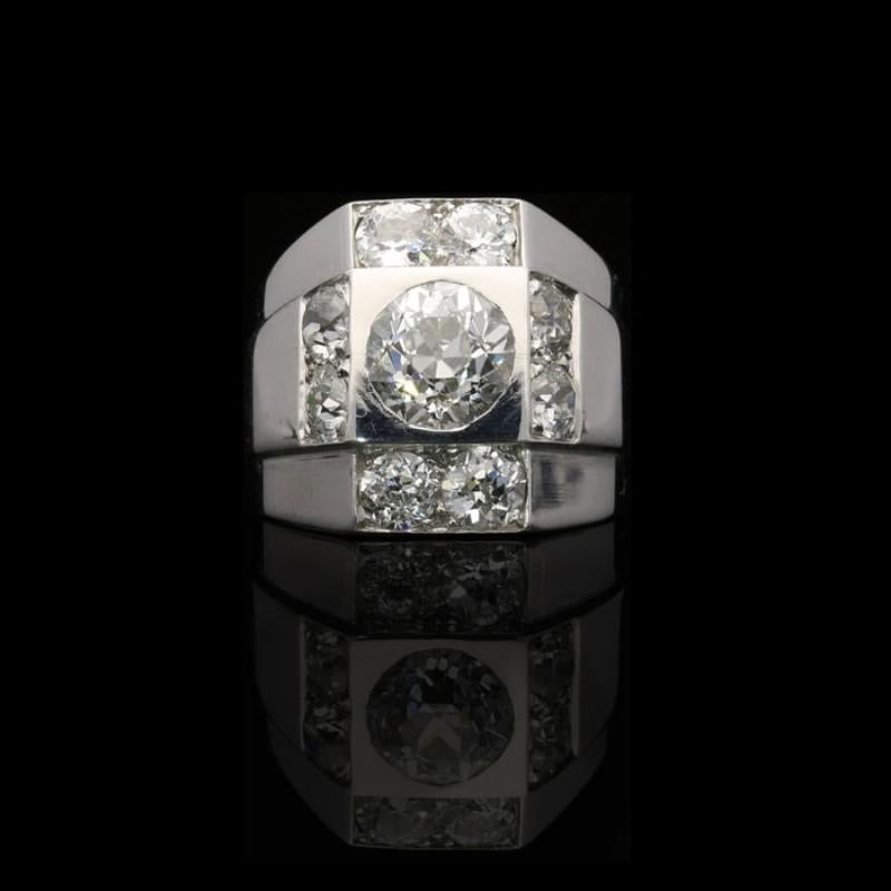 1 old European brilliant cut diamond estimated to weigh approximately 1.5 Carats
8 smaller old European brilliant cut diamonds estimated to weigh a combined total of approximately 2 Carats
Platinum with French assay mark
UK finger size I 1/2, US