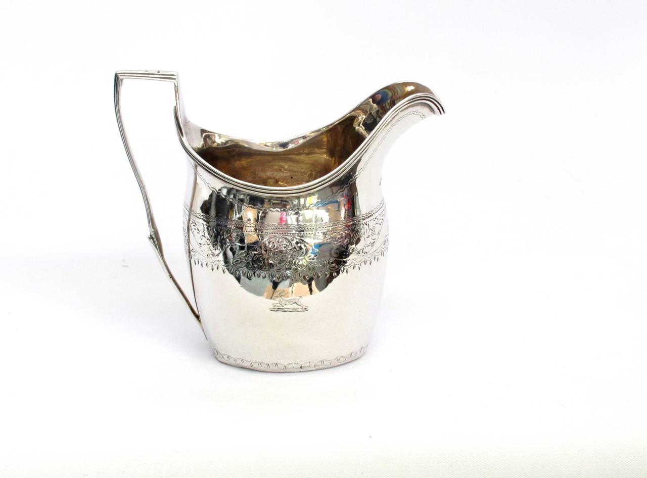 Sterling silver three piece tea set by Peter, Ann and William Bateman. 
Made in London 1801.

Tea pot- 6"t x 7"w
Sugar- 5.75"t x 7"w
Cream- 3.75" x 5.25"w