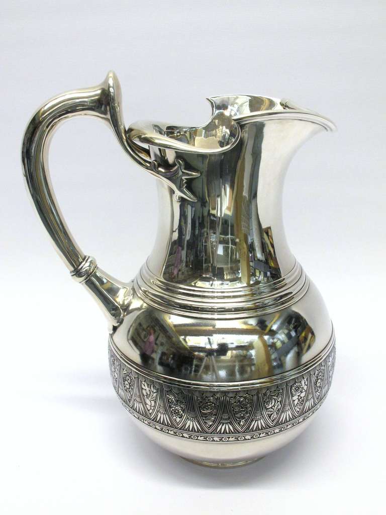 Important Gotham turn of the century water pitcher designed with sculptural lines with fine detail and a crisp hallmark.
