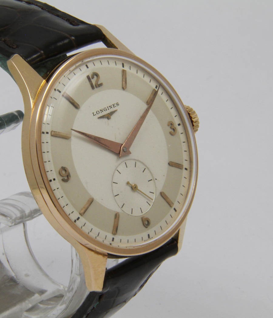 Very nice and rare classical watch, big size

Case-Rose gold, acrylic glass, d=38mm
Movement-Caliber Longines 27, manual wind
Bracelet-Leather strap, buckle

Very nice condition
Circa 1950