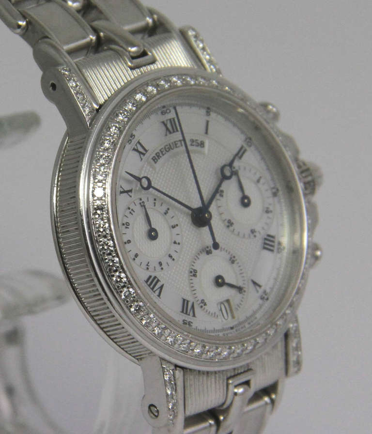 Breguet
Marine
Ref. 258

Case
18k white gold, case back secured by screws, sapphire crystal, diamond bezel and lugs

Movement
Automatic, chronograph, date

Dial
Mother-of-pearl

Bracelet
18k white gold

Box and papers
circa 2006