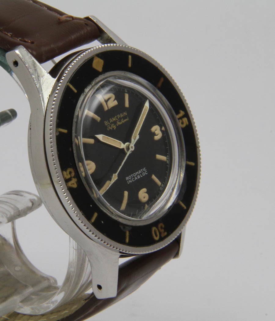 Fifty Fathoms Rotomatic 
Extremely rare, earlx military diver watch by Blancpain
CASE 
screwed case, steel, acrylic glass, rotating bezel, Fifty fathoms on case back, d= 41mm.

MOVEMENT 
cal. Blancpain/Rayville SA. Rotomatic Incabloc,