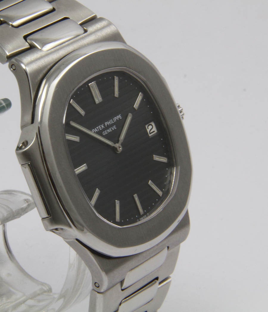 Patek Philippe
Jumbo Nautilus
Ref. 3700

Case
Stainless steel, case secured by screws in the side, sapphire crystal, 41mm

Movement
Caliber 28-255, automatic, gold rotor, chronometer, date, seal of Geneva

Dial
Original black dial and