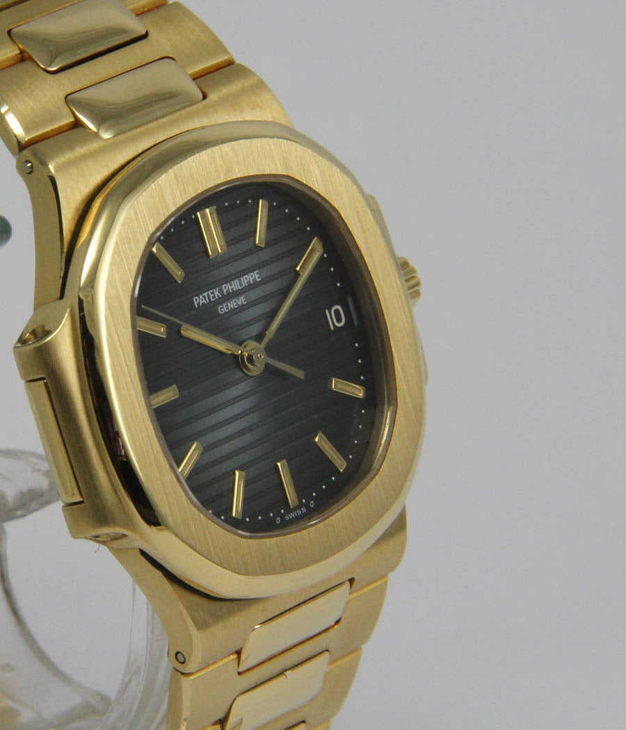 Patek Philippe
Nautilus
Ref. 3800

Case
18k yellow gold, case secured by screws in the sides, sapphire crystal, screw-down crown,  37 x 39 mm

Movement
Caliber 335SC, automatic, chronometer, seal of Geneva, date

Bracelet
18k yellow