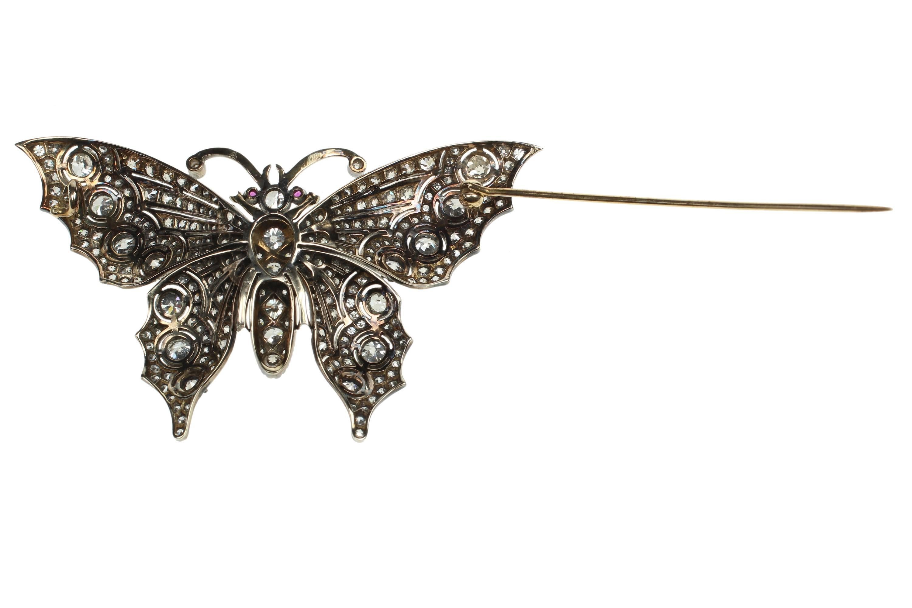 Silver and gold diamond butterfly brooch. Excellent Condition. Origin unknown. 
2.75 inches at longest wingspan and 2 inches from bottom to top.
Total diamond content approx 4 cts  c. 1900