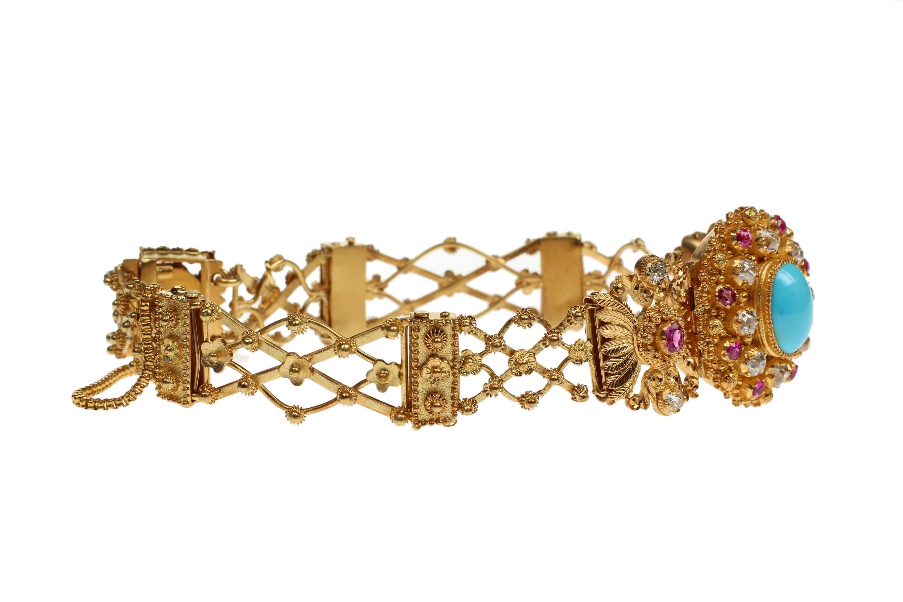 Victorian 18ct gold, diamond, ruby, turquoise bracelet with Etruscan style ornamentation. 
Main centeripiece is approx 0.8 inches by 0.7 inches and bangle circumference is approx 7 inches. inside daimeter is approx 2.5 inches
Excellent condition.
