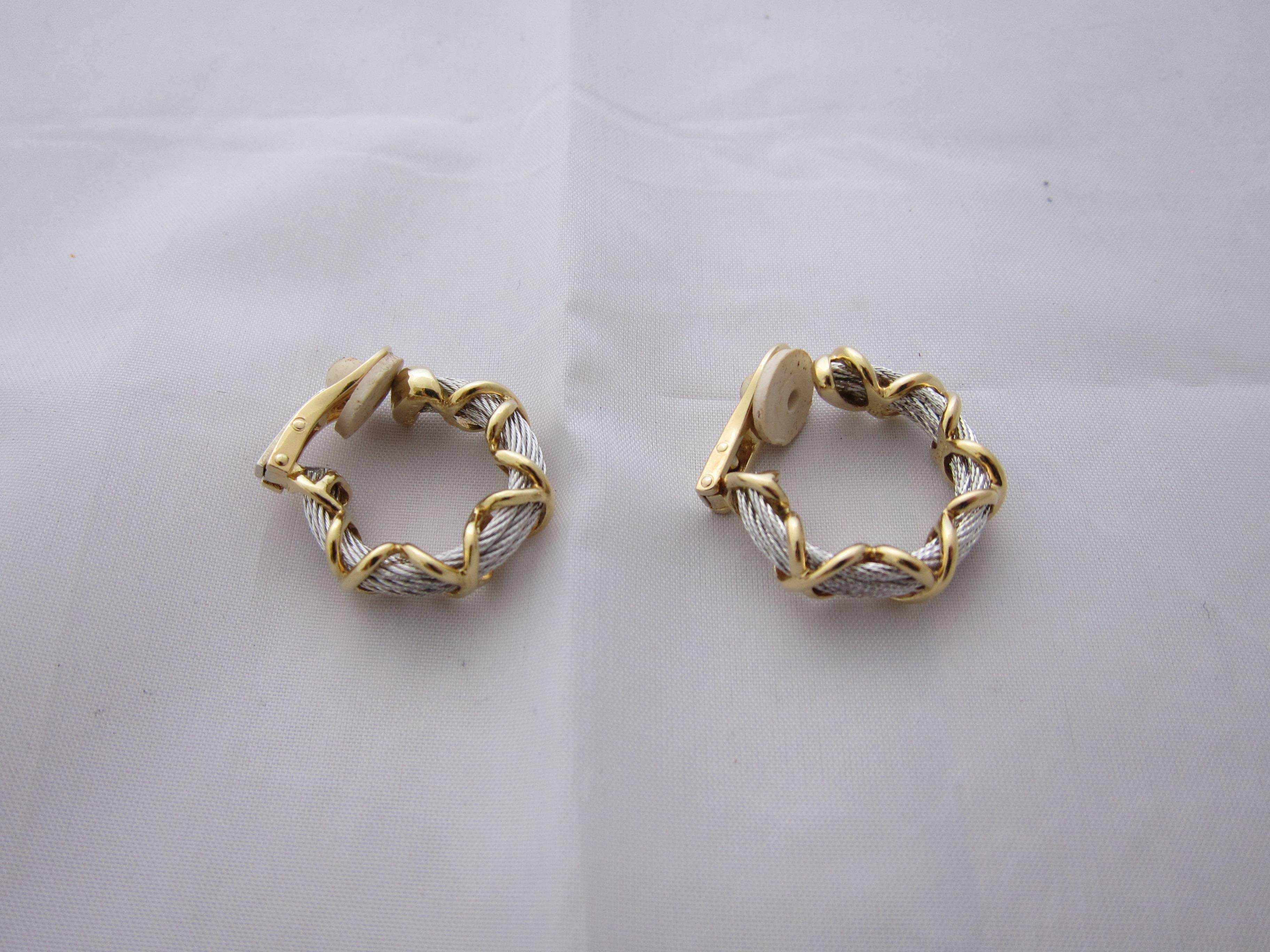 From the collection Force 10, fastastic pair of earrings signed Fred in stainless steel and gold.