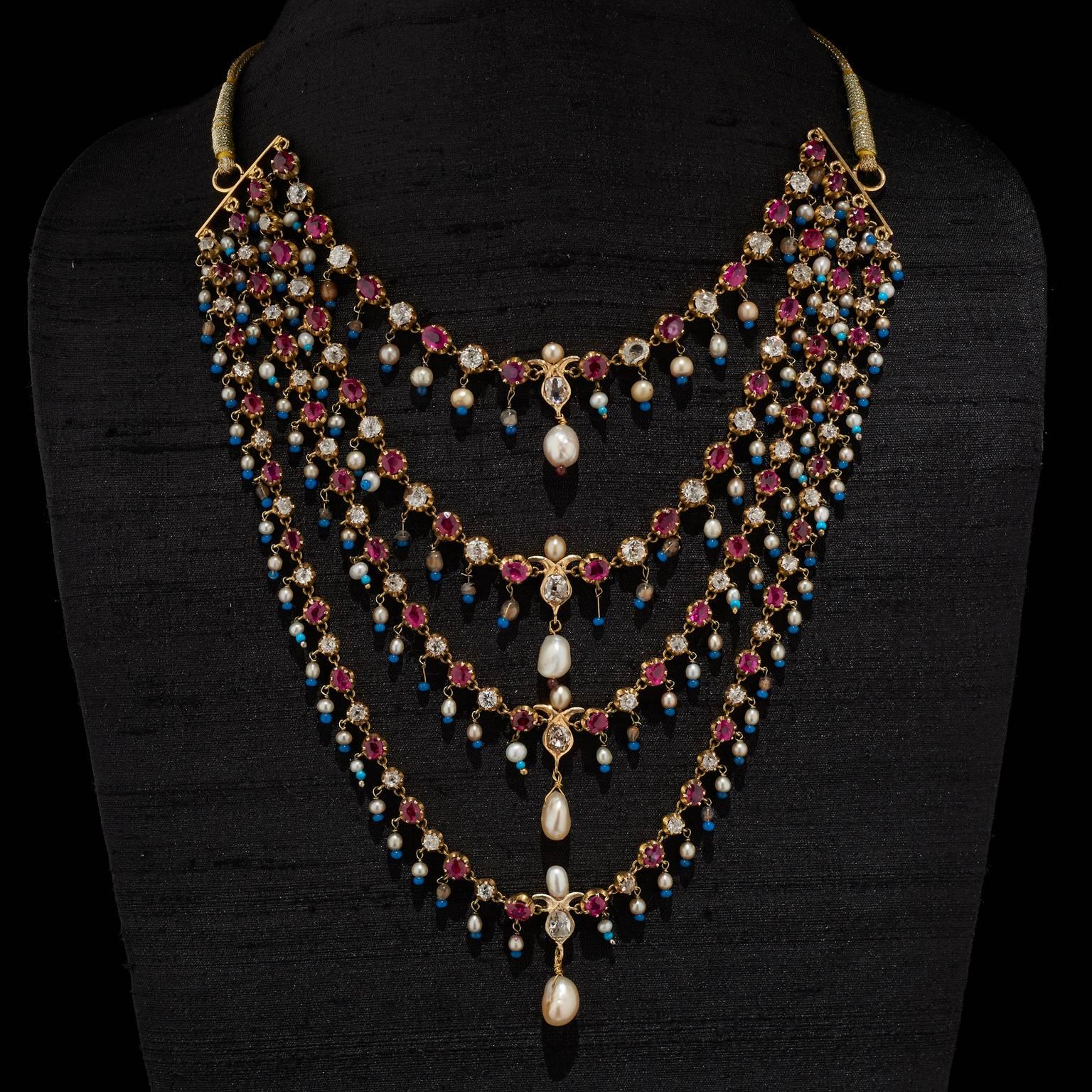 Necklace
Calcutta, West Bengal, India
19th Century

Fabricated from gold. The necklace comprises four rows of diamonds and rubies suspended with natural pearls and glass beads. Four diamond pendants in gold surmounted by a natural pearl and