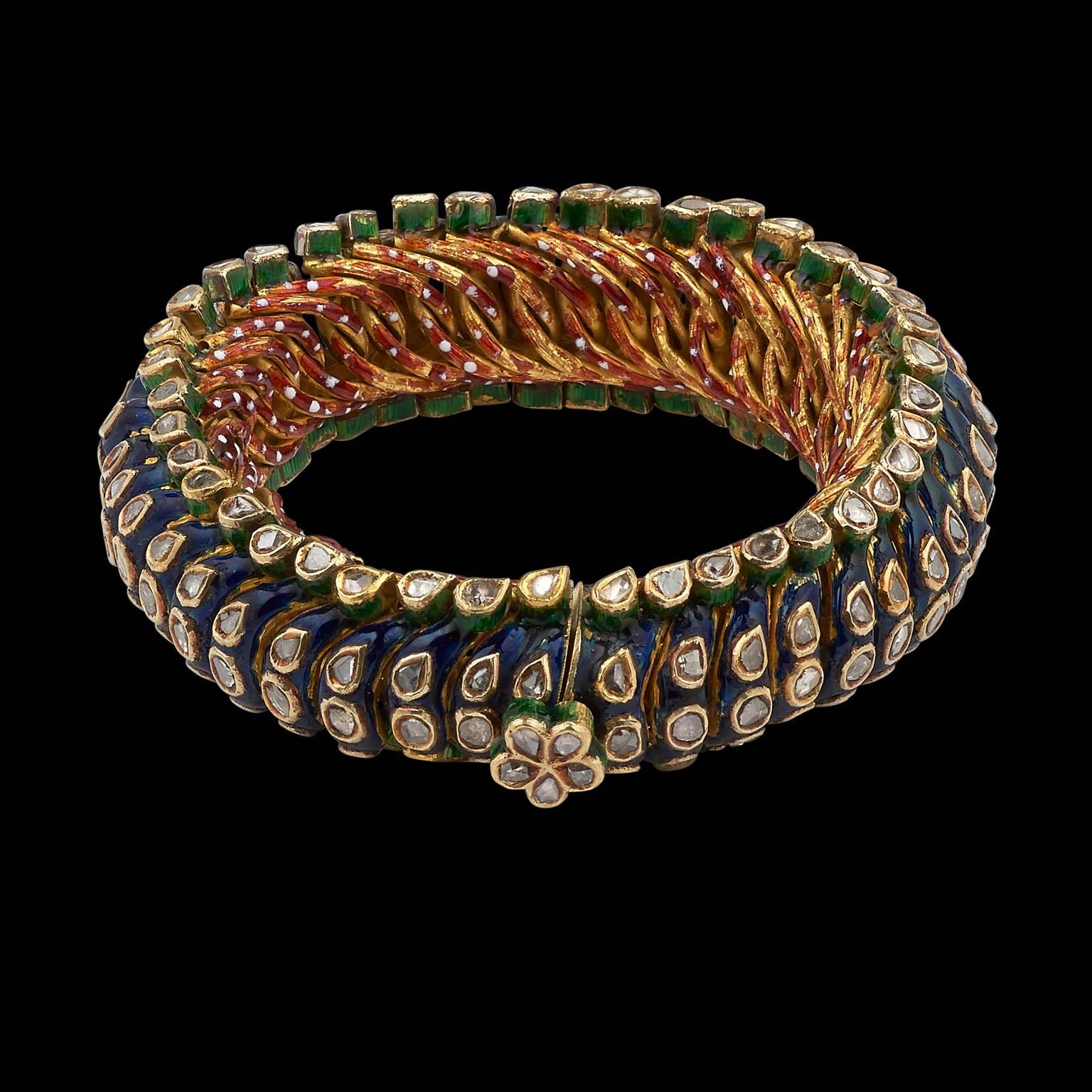 Bracelet
Rajasthan, India
Late 19th Century

Fabricated from pure gold, this 'sakla' (a traditional style) bracelet is set with diamonds on each individual element and enamelled in lapiz blue on the front and red with white flecks on the