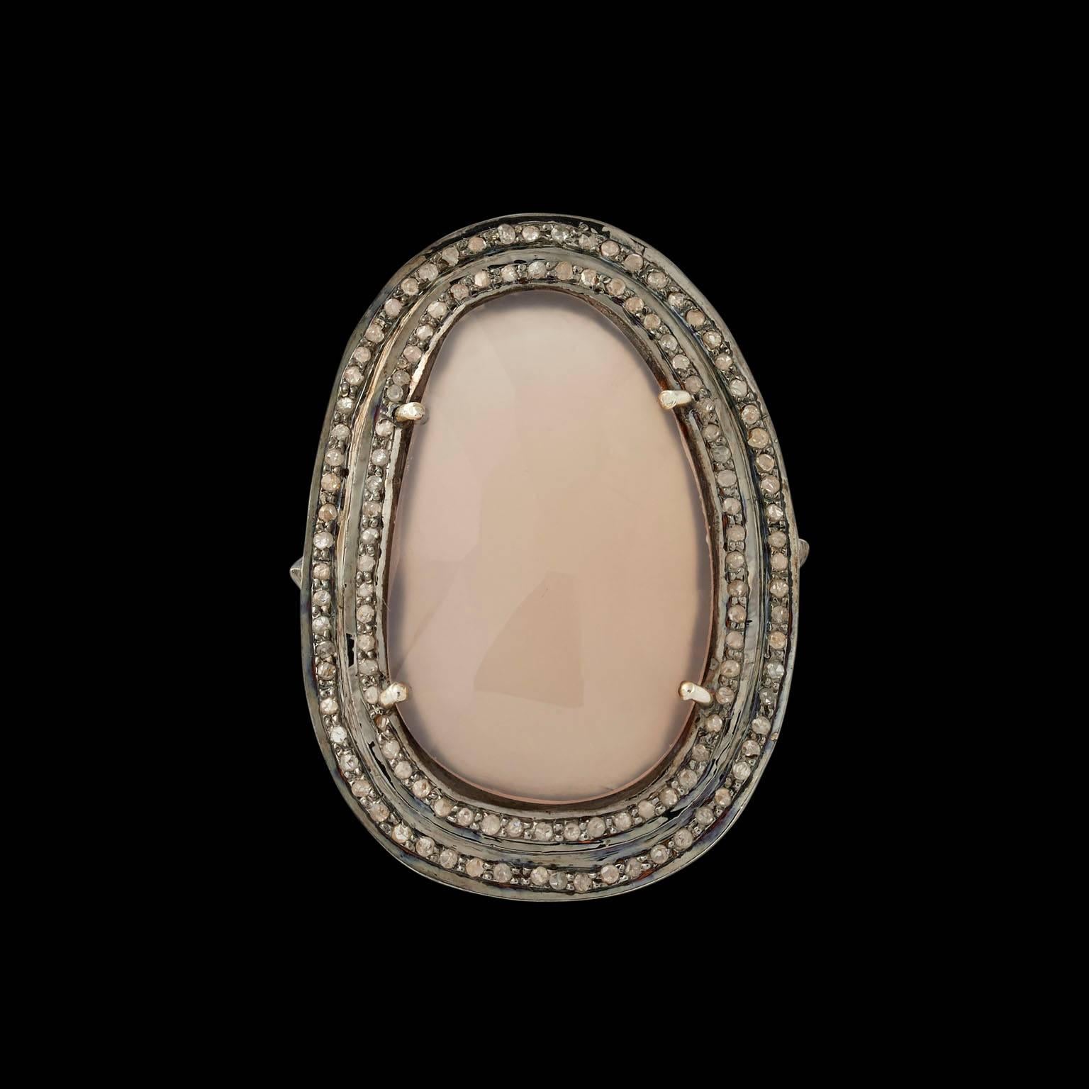 Ring
India
Contemporary

Fabricated from gold and silver set with a central corundum sapphire of light pink hue and a surround of diamonds.

UK finger size O