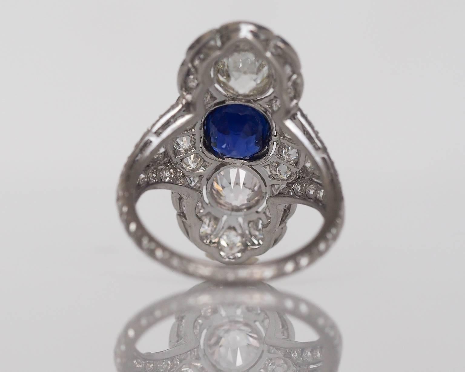 A true work of art. This is a one of a kind piece, and it features on of the rarest gemstones known to mankind. The center sapphire is a AGL certified Kashmir origin, with no treatment or enhancement whatsoever. The stone is VVS clean, and is a