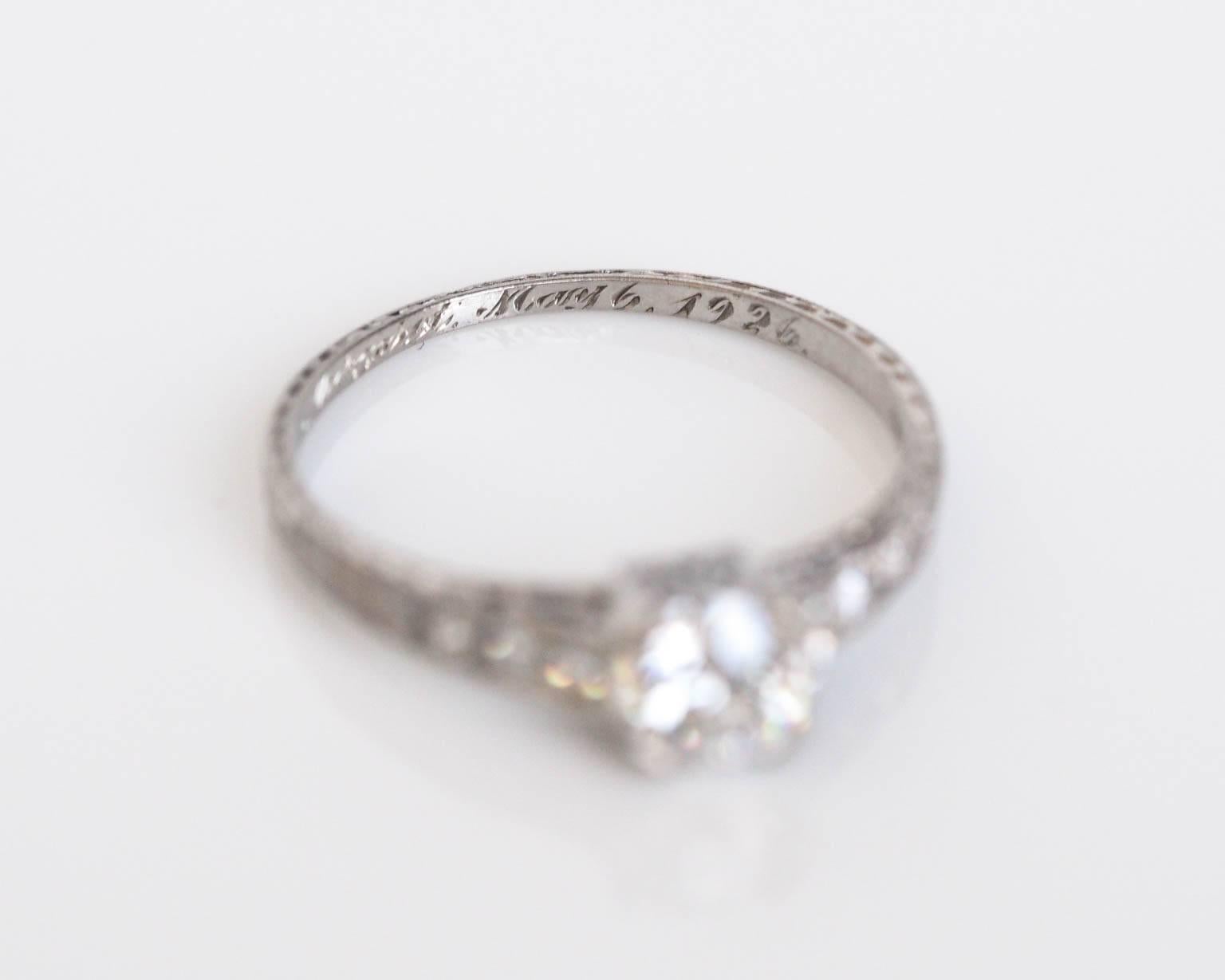 This piece is a special one, as the center diamond is an extremely white old european cut, with GIA paperwork stating 