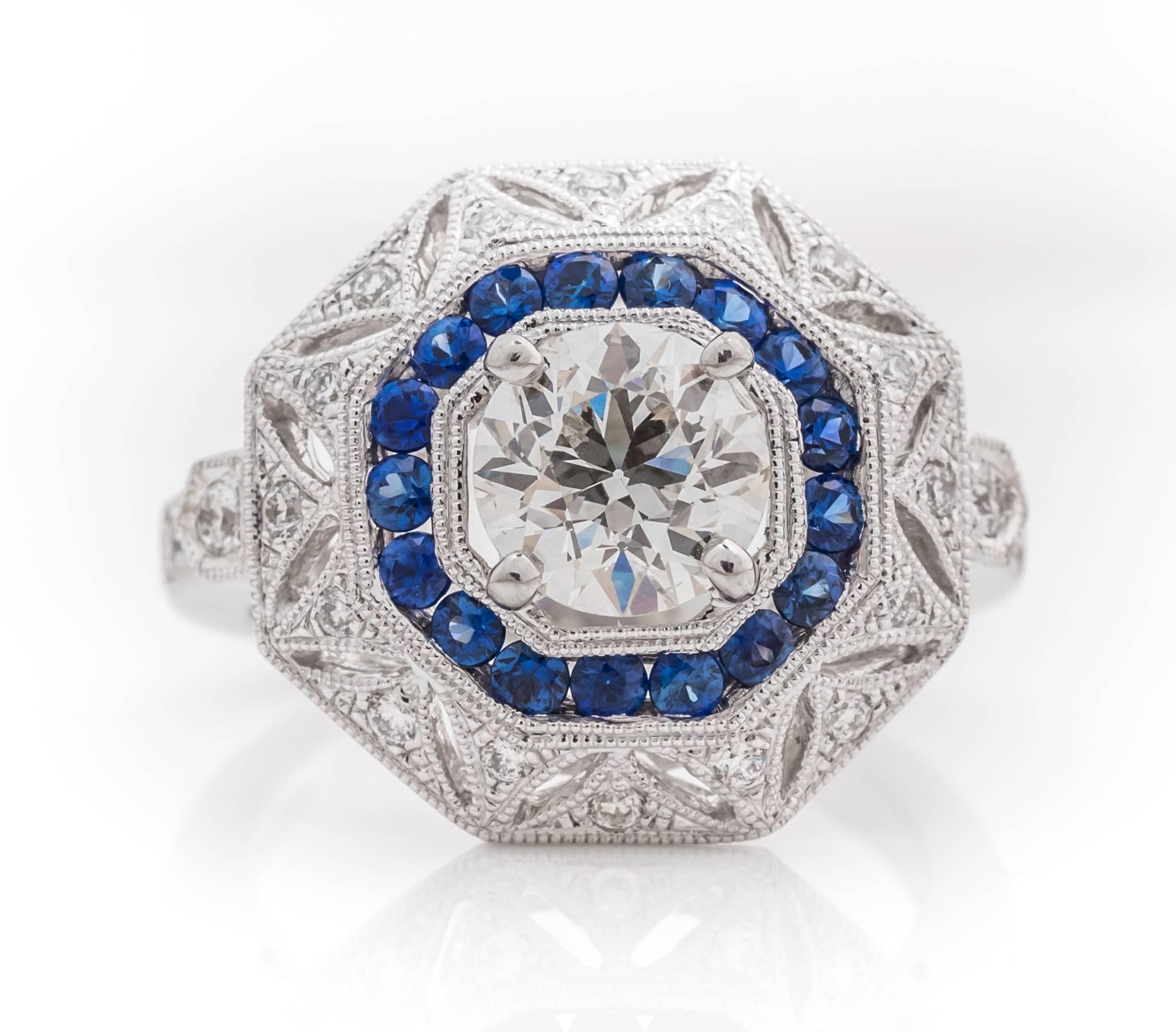 Art Deco Era Old European Diamond sitting flush in a brand new Verma Made antique-inspired mounting encrusted in accent diamonds and sapphires! 

Metal Details:
Type: Platinum
Weight: 11 Grams
Ring Size: 6
Hallmark visible: PT900 for platinum
