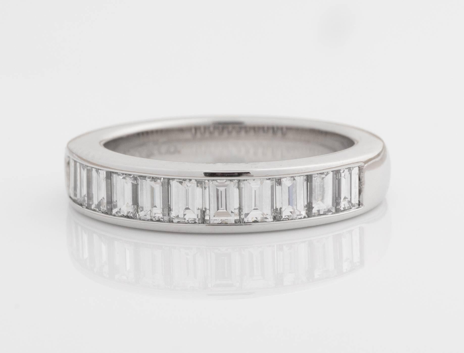 Tiffany and Co. Diamond Band

Features 1.0 carat total weight Baguette Diamonds, Channel Set in Platinum. Diamonds cover the front half of the ring. The back half of the shank is smooth for wearing comfort.

This Stunning Diamond Ring fits a size 4