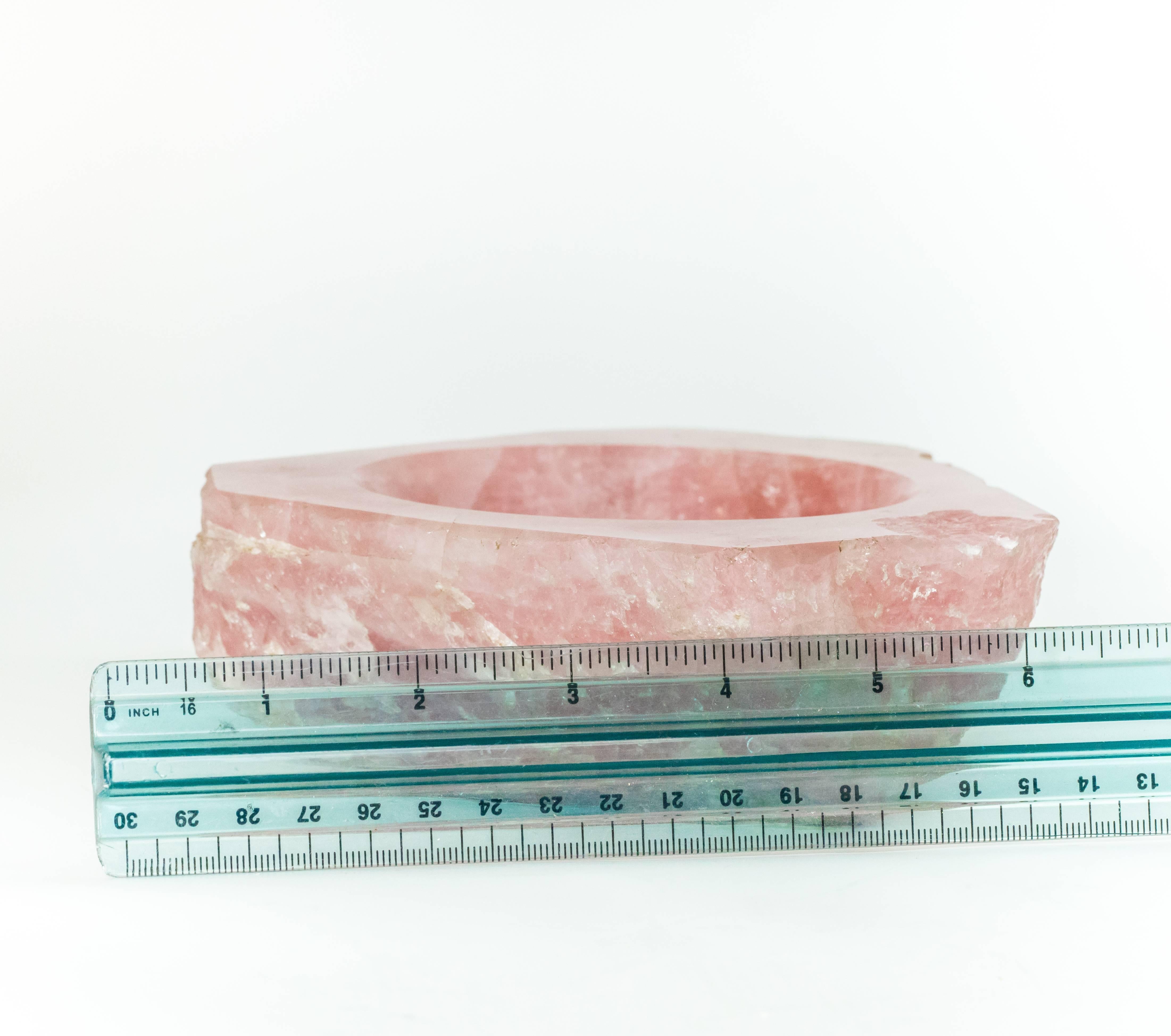 A rare find with only one of five known to exist. This is a rose-colored mineral catch-all paperweight created by Cartier in the 1960s. The base of the paperweight is made of a sterling silver plate. Hallmarks visible here are 