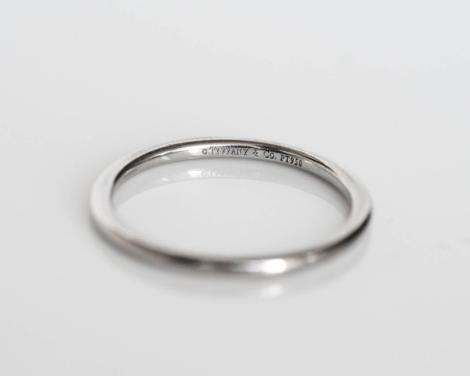 Here is an awesome Platinum TIFFANY & CO. wedding band. Ultra classic!  A great piece to compliment an engagement ring, or to even stack with other bands or wear alone!

This ring can be sized up or down 1 size for an additional $30. If you wish