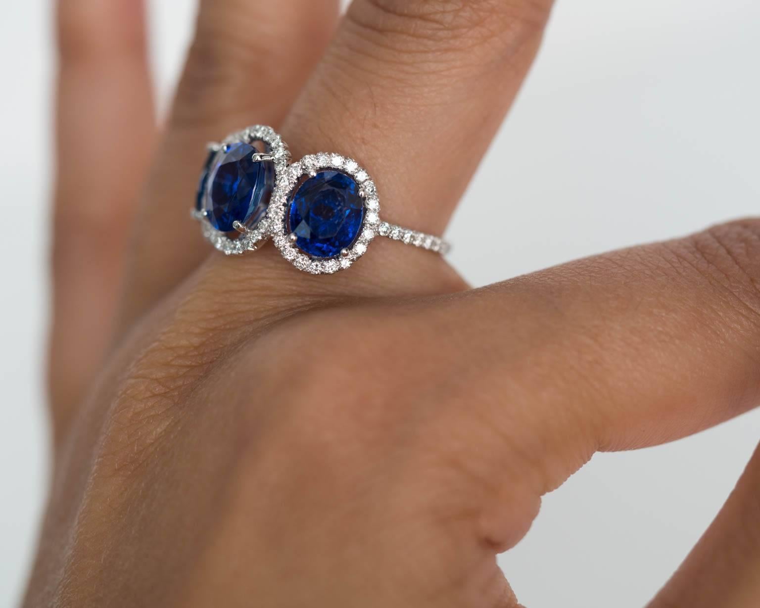 This platinum handcrafted piece is nothing short of breathtaking and spectacular. The sapphires are all unheated and Burma origin. Approximate size on the sapphires is about 2 carat center and 1.75ct each side. They are surrounded in a halo of micro