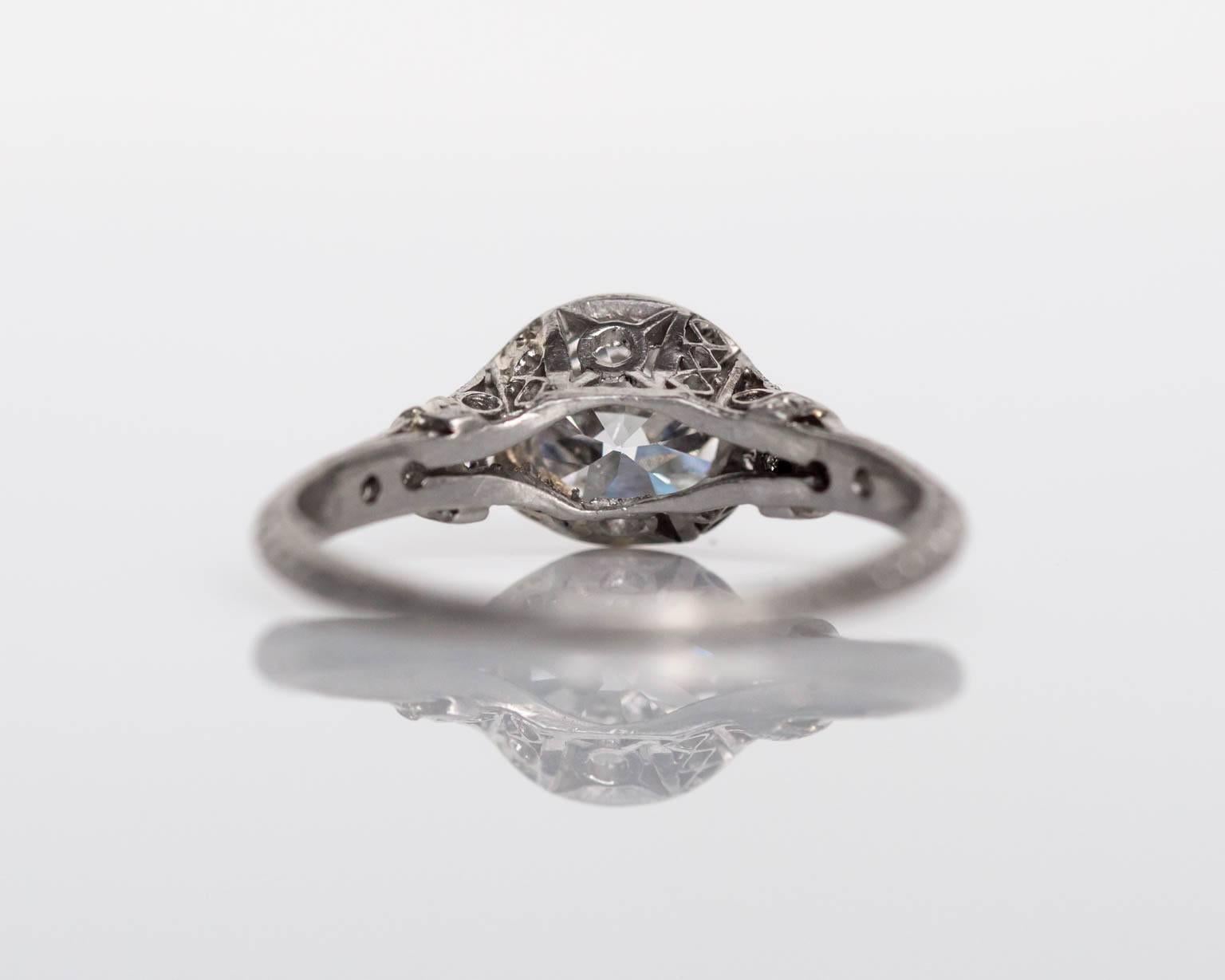 1920s Art Deco Platinum 1.01 carat Diamond Engagement Ring with Side Stones In Good Condition In Atlanta, GA