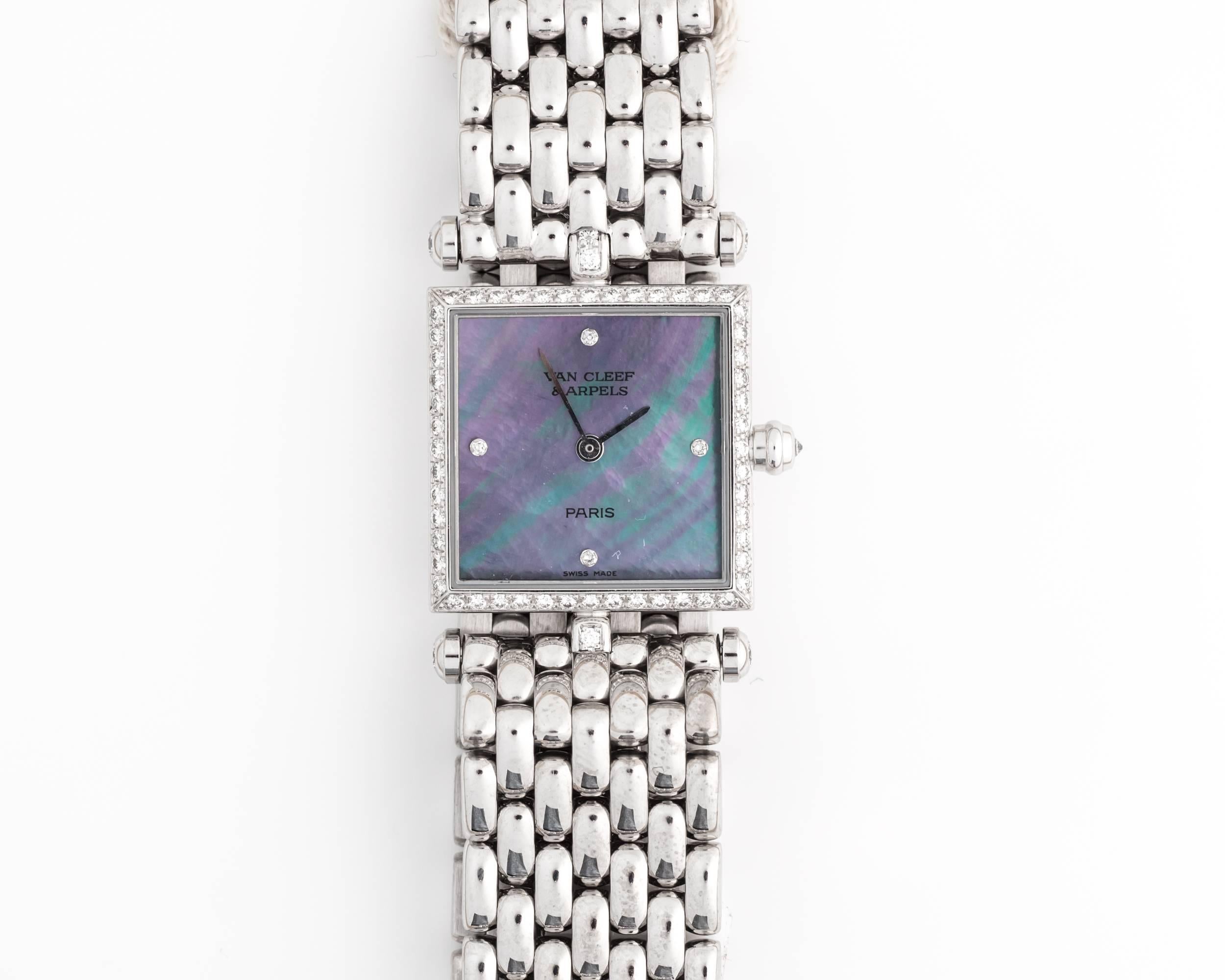 Beautiful Van Cleef & Arpels watch, unique and rare combination.
Watch features Tahitian Mother of Pearl dial and 4 diamonds at 3, 6, 9 and 12 o'clock position; additionally, embellished with a diamond bezel. 18K White Gold Bracelet with double
