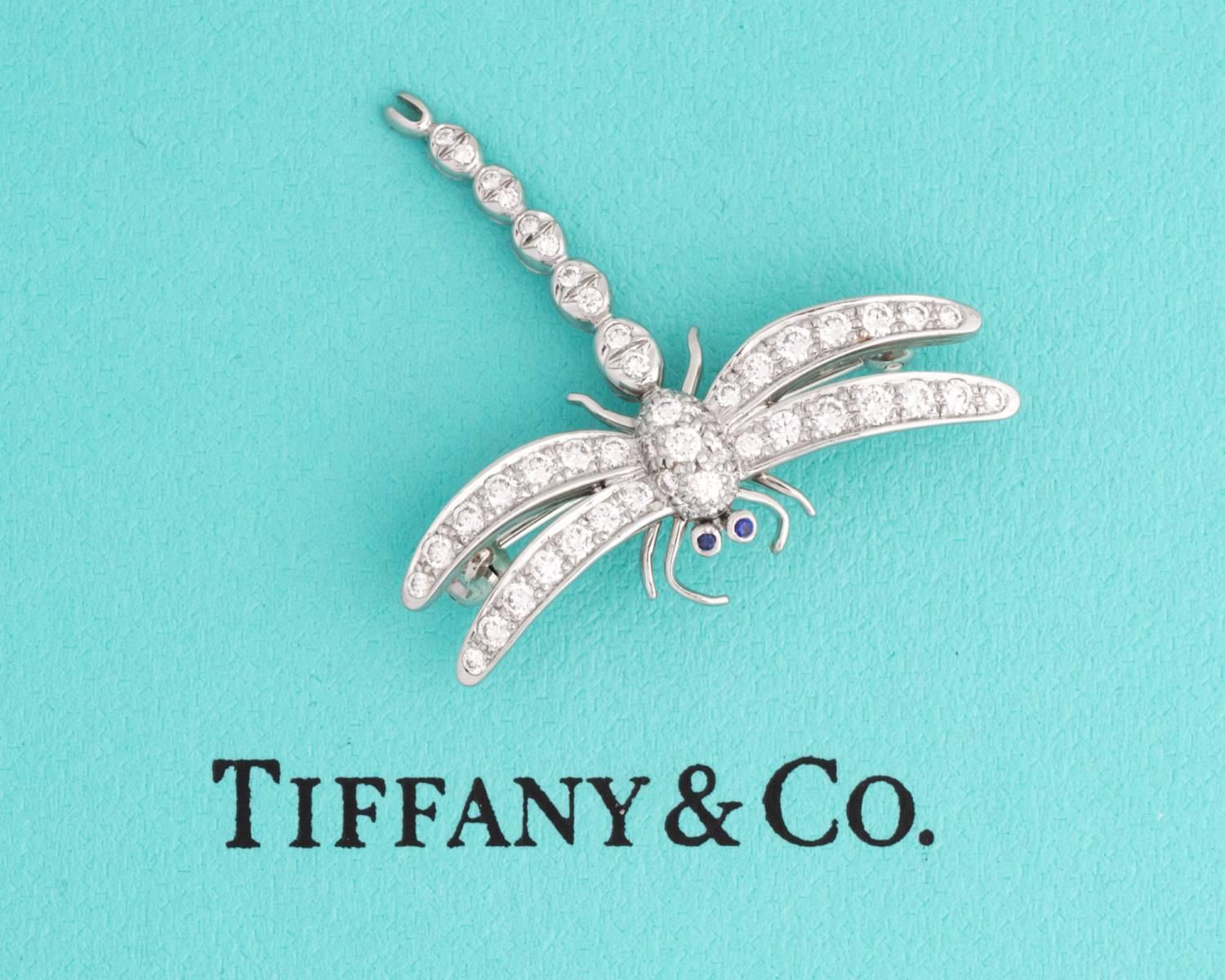 This limited edition dragonfly pin is a unique and rare Tiffany vintage item. Collection was made in 1996, and has since been retired. Crafted in platinum, many details are visible throughout to display the dragonfly's legs, wings, and torso. A