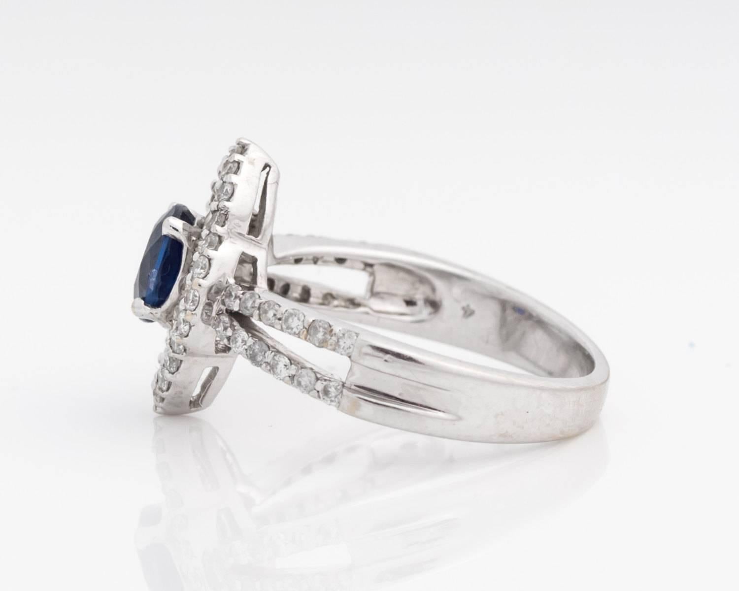 Brand new custom made ring made in house! The ring is completely new and has never been worn before. This is a great option for an engagement ring, sapphire September birthstone gift, or fanciful cocktail ring! The deep blue sapphire is a natural