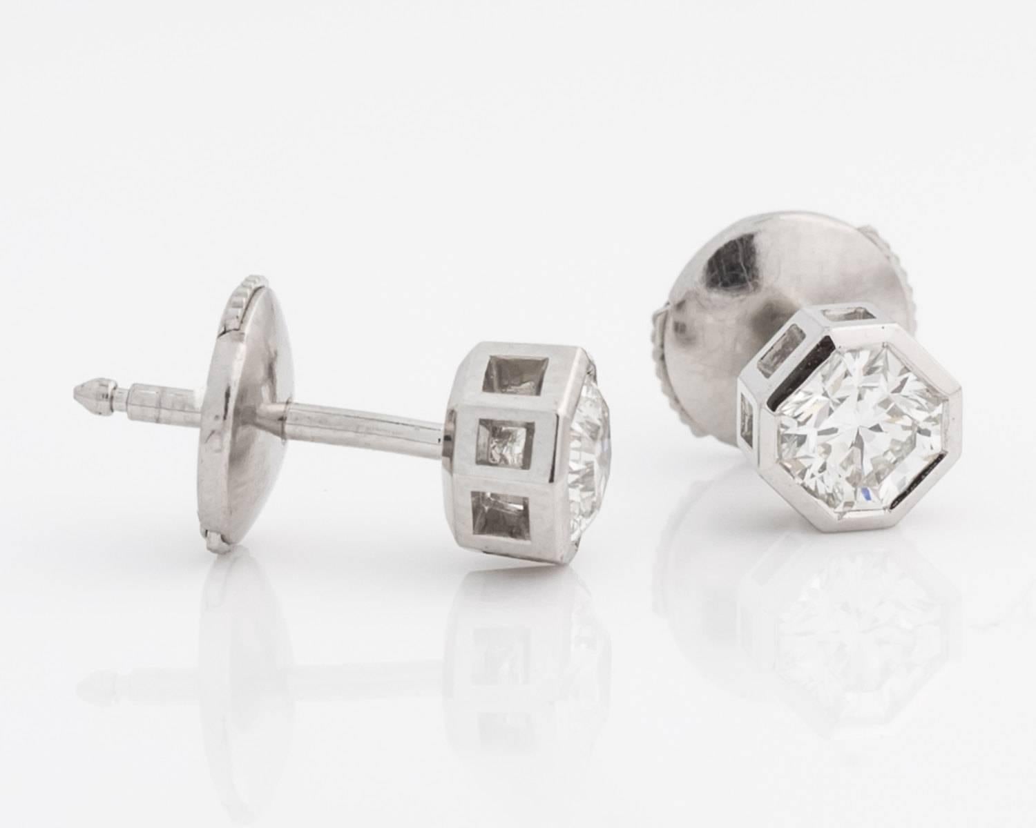 Platinum Tiffany & Co. Lucida Hexagon Diamond Earrings. 
2 Hexagon cut diamonds, measuring a total of 0.80 carats and boasting F color VS clarity and sit flush in a platinum bezel frame. No longer available at Tiffany & Co, making this item both