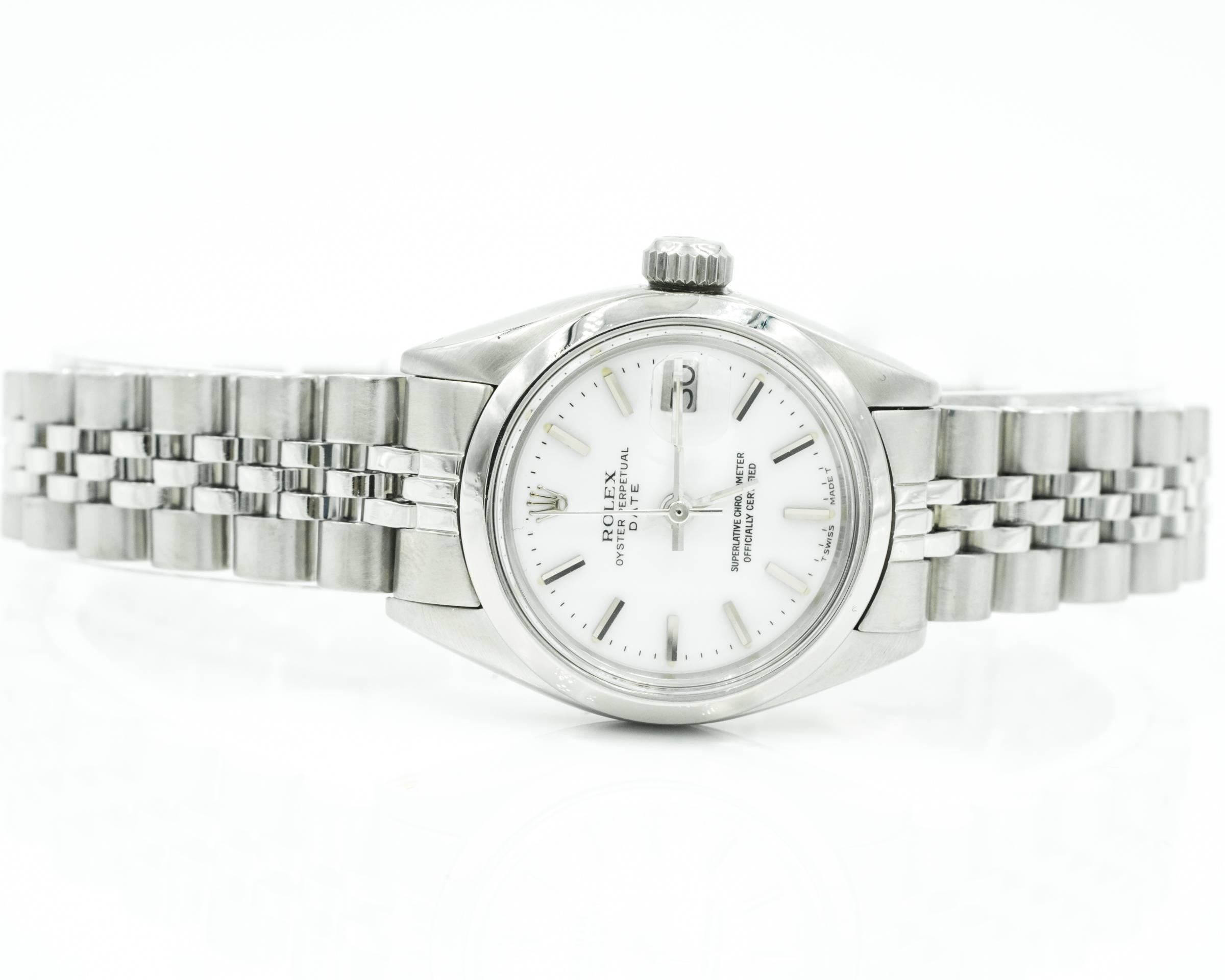 Vintage 1977 Ladies Rolex Date Oyster Perpetual
Stainless Steel, White Dial
Fits up to 8 inch wrist, lots of extra links
Classic Rolex Jubilee bracelet with some slouch. 
Watch has been recently serviced and polished. Amazing condition. 
White
