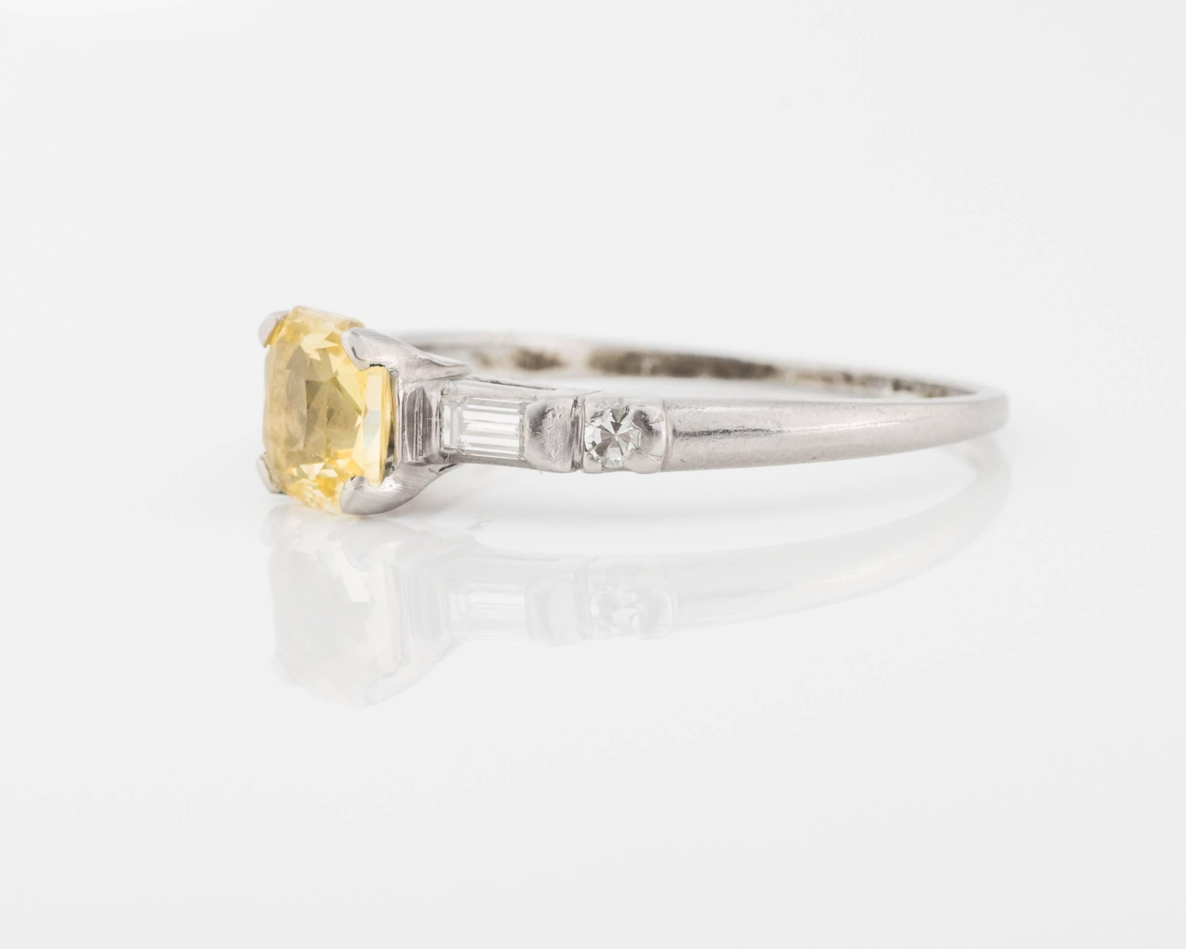 Platinum Ring Featuring 1.14 Carat Unheated Sapphire. Square-Radiant Cut, VS clarity and Pale Canary Yellow in Color. 
Classic 4-prong setting holds the sapphire. Nice dainty shank, 2mm. 
Accent diamonds - round single cut diamond (0.01 carat) and