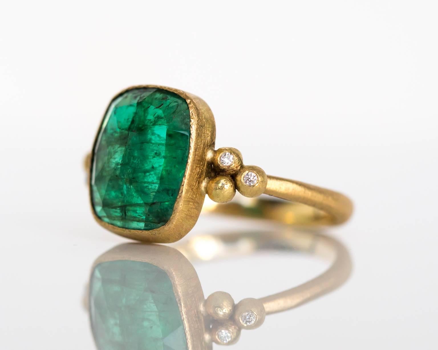Item Details: 
Ring Size: 7.25
Metal Type: 18 Karat Yellow Gold
Weight: 4.2 grams

Color Stone Details: 
Type: Emerald
Carat Weigh: 2.00 carat
Color: Green

Diamond Details:
Carat Weight: .05 carat, total weight
Color: F
Clarity: VS
