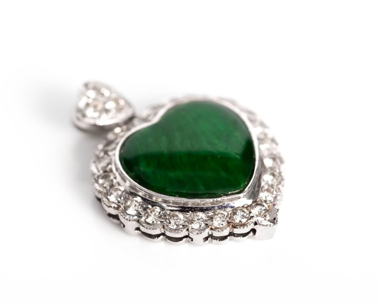 Item Details: 
Metal Type: 18 Karat White Gold
Weight: 4.44 grams

Color Stone Details: 
GIA Report Number: 2185060105
Type: Jadeite Jade
Shape: Heart
Cutting Style: Cabochon
Color: Green

Diamond Details: 
Carat Weight: .40 Carat, total