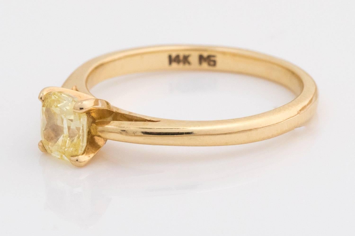 Fancy Canary Yellow Natural Diamond Engagement Ring

Metal Type: 14 karat Yellow Gold
Ring Size: 4.5 (resizable 2-3 sizes up or down)
Weight: 1.8 g
Band Height: 5.5 mm

Diamond Details:
Cut: Cushion Cut
Carat Weight: .50 carat
Color: Fancy