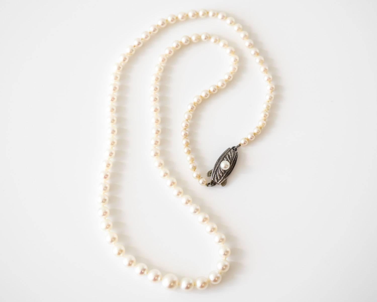 Mikimoto Graduated Pearl Necklace from 1950s
Timeless and Classic Piece
Mikimoto Hallmarked Stamped on the Clasp
Top of Clasp features an accent Pearl for that extra flair
Standard Pearl Necklace with Graduated Design, meaning the pearls at the