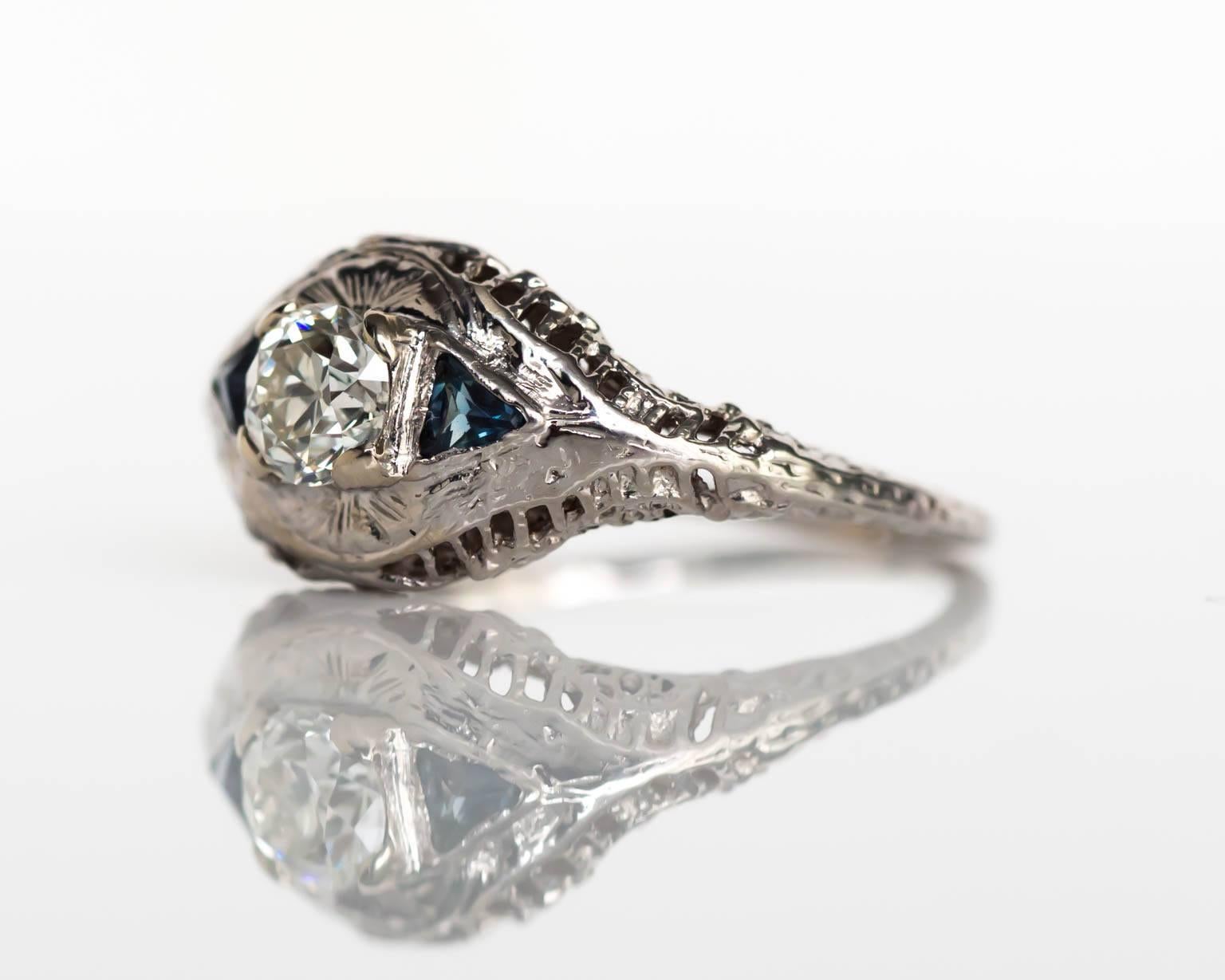 1920s Art Deco 18K White Gold GIA Certified .44 Carat Diamond Engagement Ring with Blue Sapphires & Filigree Work

Item Details: 
Ring Size: 5.5
Metal Type: 18 Karat White Gold
Weight: 2.5 grams

Center Diamond Details
GIA CERTIFIED Center