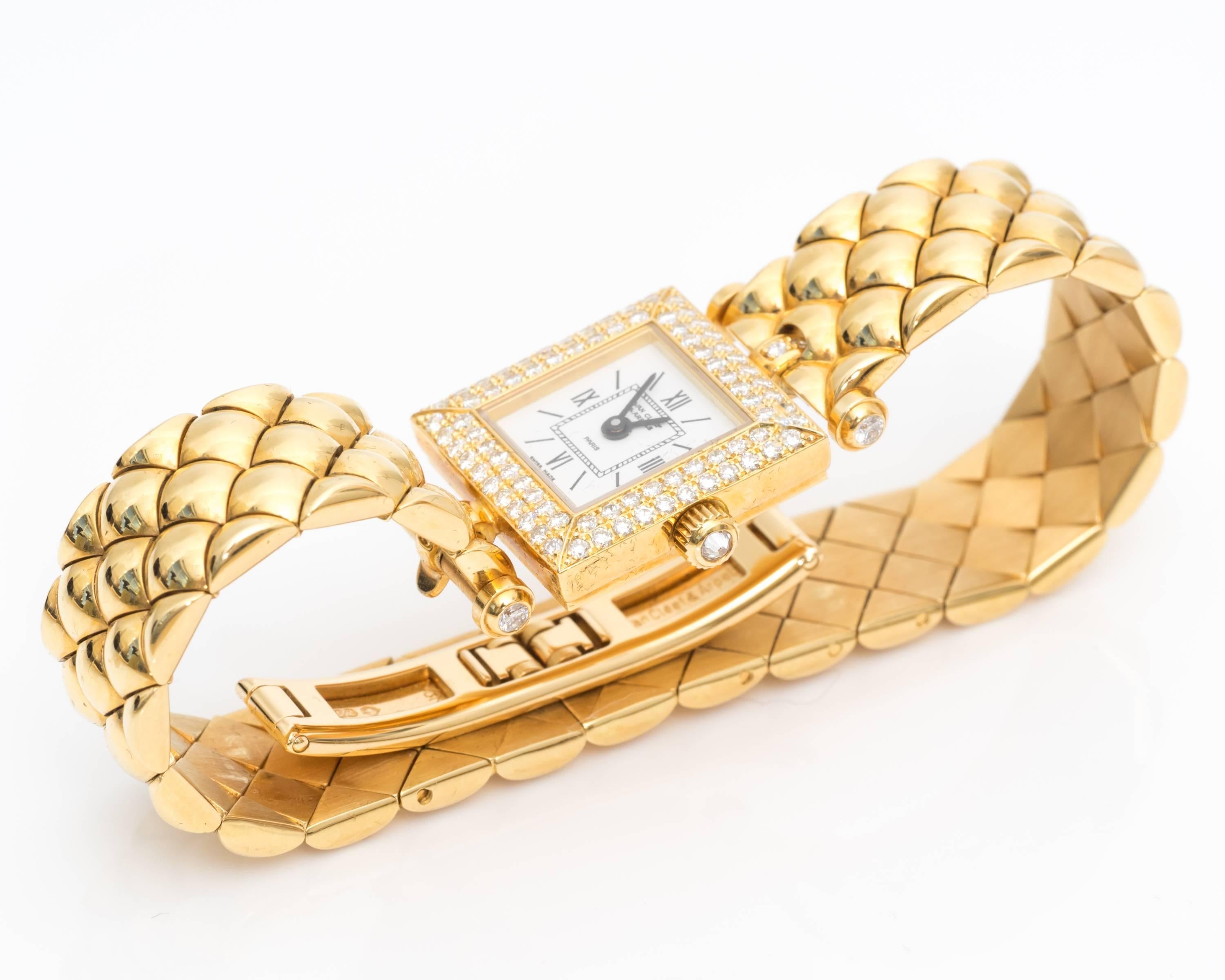 Beautiful Van Cleef & Arpels watch, unique and rare combination.
Watch features White Enamel Dial embellished with a diamond bezel
18K Yellow Gold Bracelet with double deployment clasp
Swiss Quartz movement.

Measurements include:
20mm x 20mm case