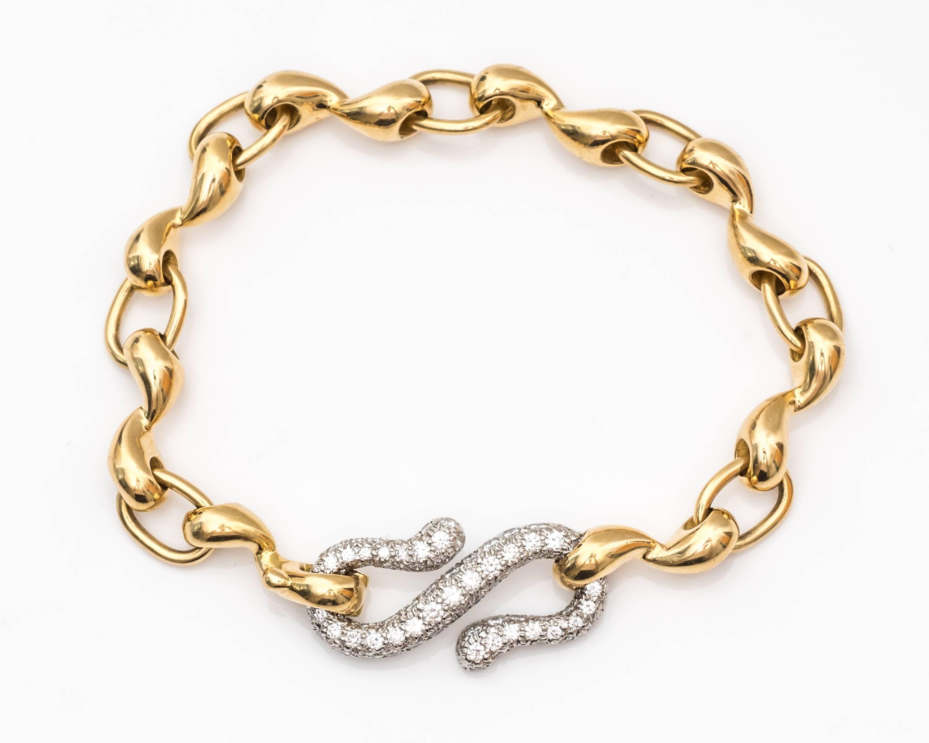 Tiffany & Co. Platinum and 18 Karat Gold Bracelet
"S" Link - Extra Large embellished in Diamonds, Pave Set
F color, VS clarity Diamonds, 2 Carats Total Weight
7 Inch Bracelet
Lock Mechanism/Clasp attached to "S" link