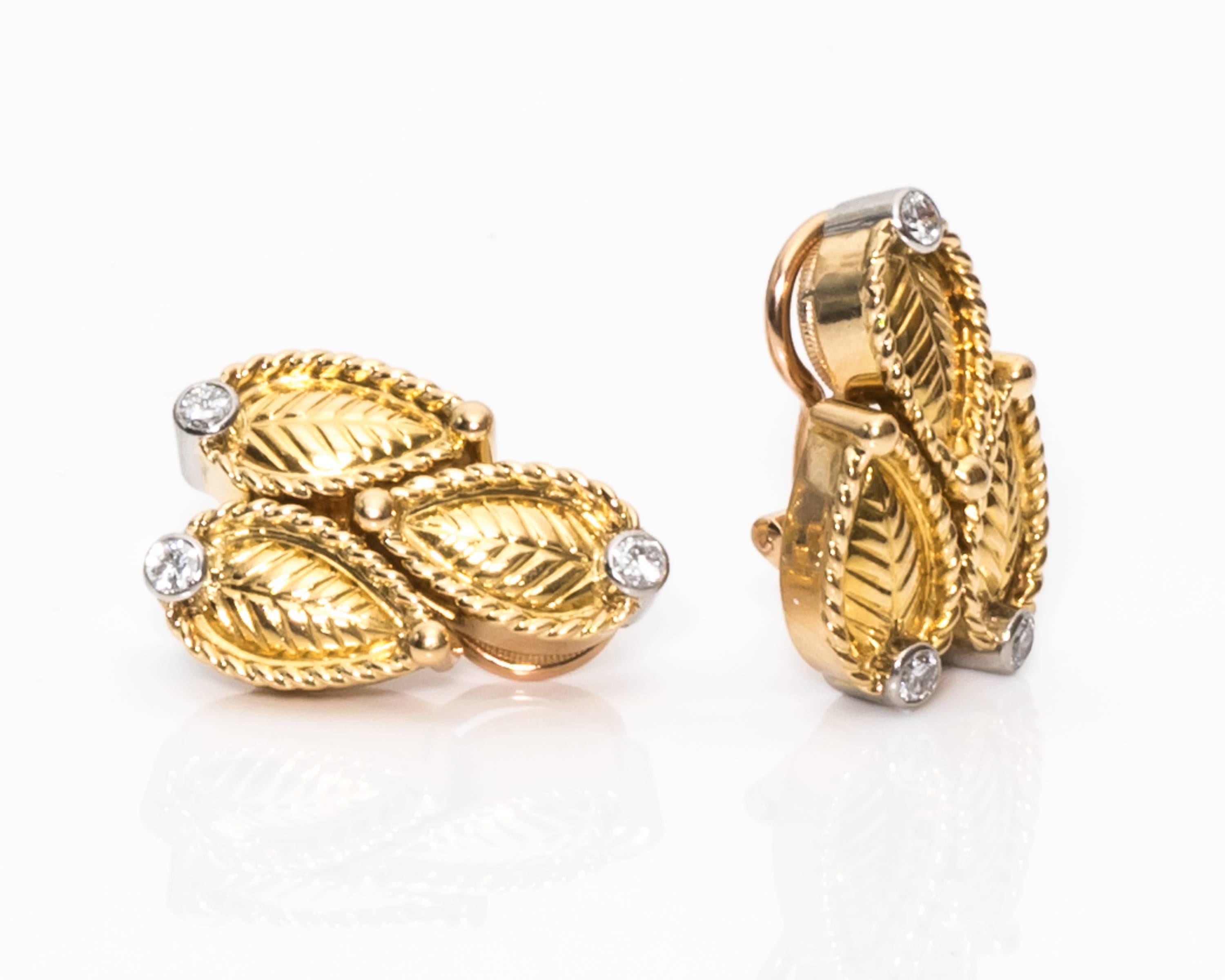 Cartier Paris Clip Back Earrings - 18 Karat Yellow Gold, White Gold, Diamonds

3-Leaf Motif Design with Diamonds
3 Diamonds On Each Earring
F Color, VS1 Clarity, 0.50 carat Total Weight
18 Karat Yellow Gold with White Gold Accents
Clip On