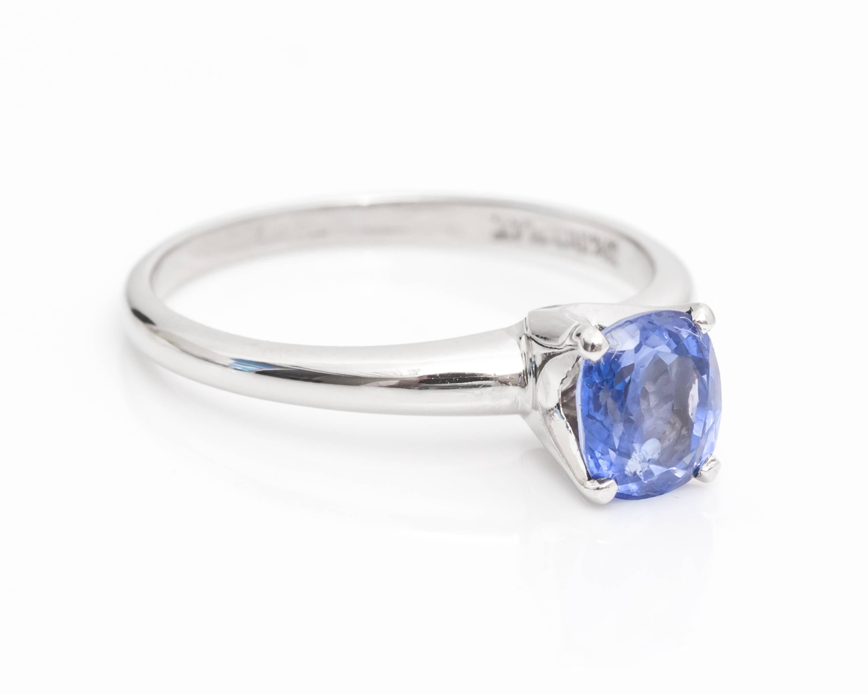 Beautiful Ring with a Cornflower Blue/Purplish Color Sapphire
Features a Cushion/Oval Shape, giving it plenty of sparkle from all angles and allows an elongated look for a slender look. 
Sapphire is a total of 1 carat total weight
Ideal for a