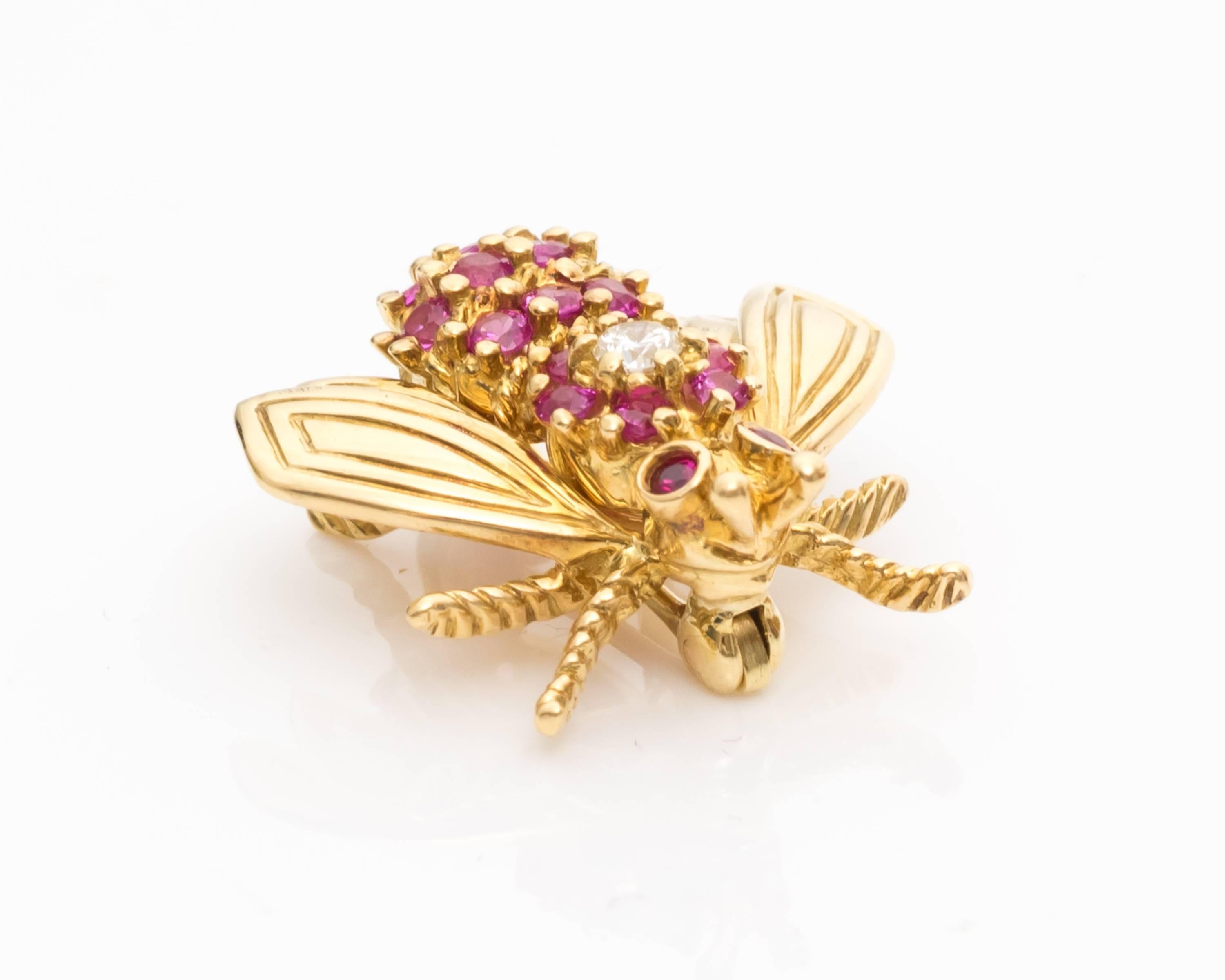 Tiffany & Co. Bee Pin
Crafted in 18 Karat Yellow Gold
Features Pink Sapphires on the Body, 0.50carats total weight
Eyes are made of Pink Rubies 
Center Diamond Featured on Top is 0.10 carat total weight, G color VS clarity
Hallmarked 750 (for 18