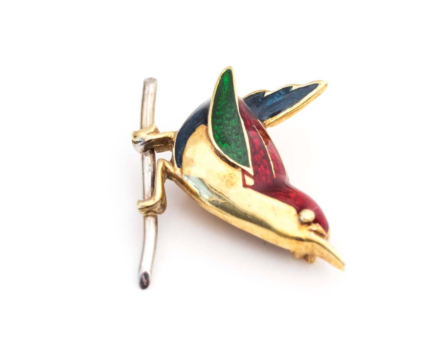 Simple Exquisite Pin with Assortment of Colorful Enamel
Bird's Body made of 14 Karat Yellow Gold
Branch on which the Bird is Perched is 14 Karat White Gold
Vibrant Enamel Decorated Throughout the Feathers in Red, Green and Blue
Enamel has a Lustrous
