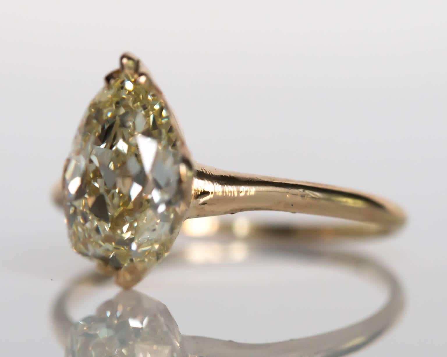 Item Details: 
Ring Size: 7.5
Metal Type: 14 Karat Yellow Gold 
Weight: 2.7 grams

Center Diamond Details
GIA CERTIFIED Center Diamond - Certificate #2185218701
Shape: Pear Brilliant
Carat Weight: 2.13 carat
Color: N
Clarity: VS1


Finger to Top of