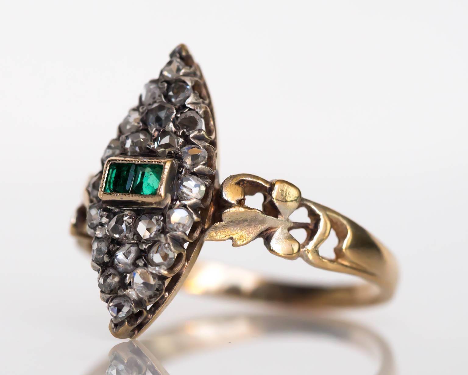 Item Details: 
Ring Size: 8
Metal Type: 18 Karat Yellow Gold
Weight: 3.7 grams

Diamond Details:
Shape: Antique Rose Cut
Carat Weight: .60 carat, total weight
Color: H-I-J
Clarity: SI

Color Stone Details: 
Type: Emerald
Carat Weight: .50