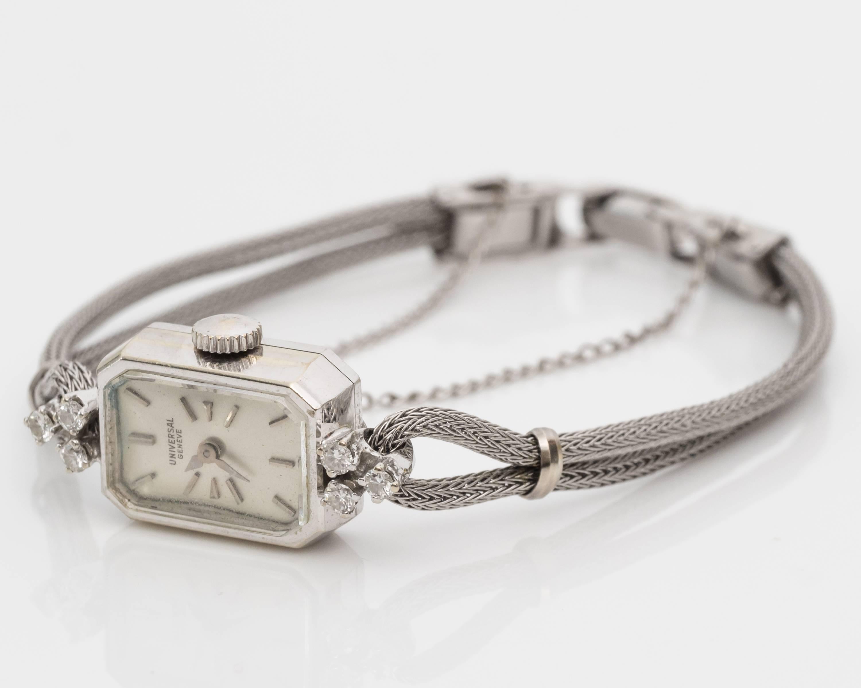 1950s Women's Wristwatch, Simple yet Stunning design! 
Swiss made, Universal Brand (Hallmark UNIVERSAL GENEVE SWISS is written next to the dial)
Features three diamonds set in a cluster on each end of the watch (6 diamonds total); Diamonds total to