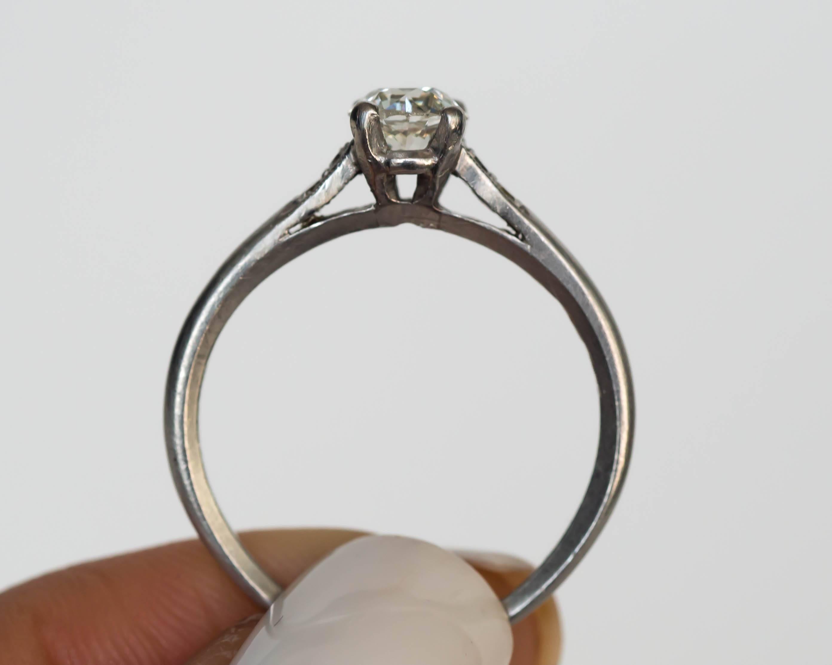 1905 Edwardian Platinum GIA Certified .66 Carat Diamond Engagement Ring In Excellent Condition In Atlanta, GA