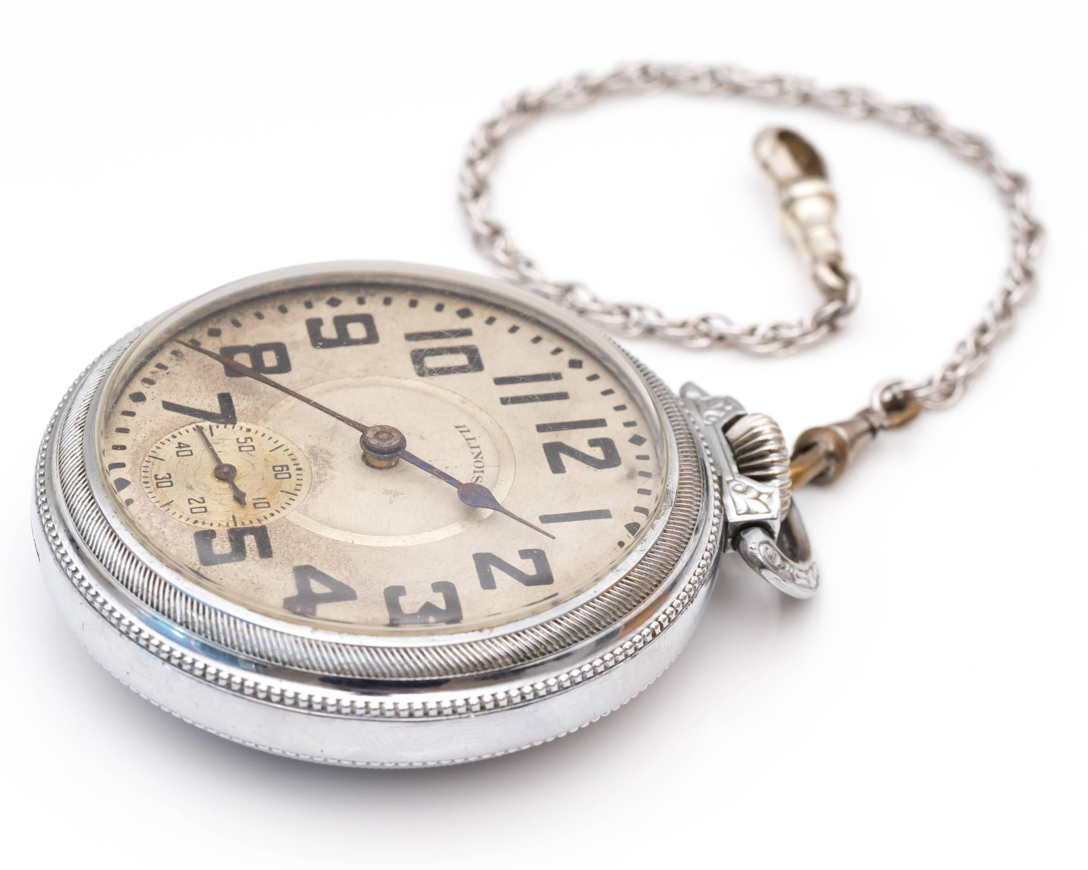 1900s Edwardian Illinois Railroad Stainless Steel Pocket Watch. A traditional railroad Illinois watch for collector's or users alike! The surface of the watch has numbers to indicate each marker except for the number 