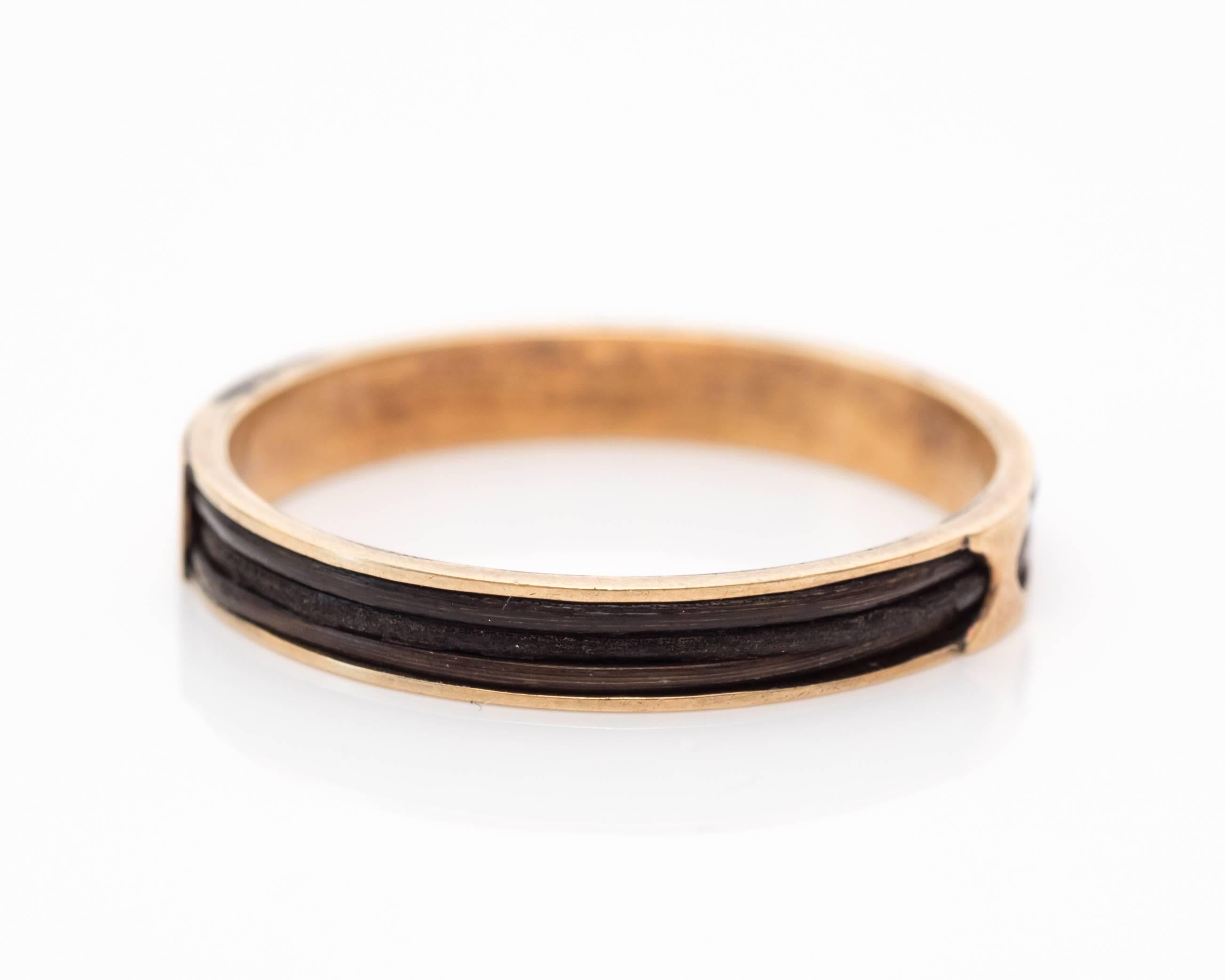 Mourning rings were worn by loved ones who had lost a significant other. This ring has space for where a monogram was once etched, but due to age it appears to have worn off from the gold. There is another gold accent on the opposite side of the