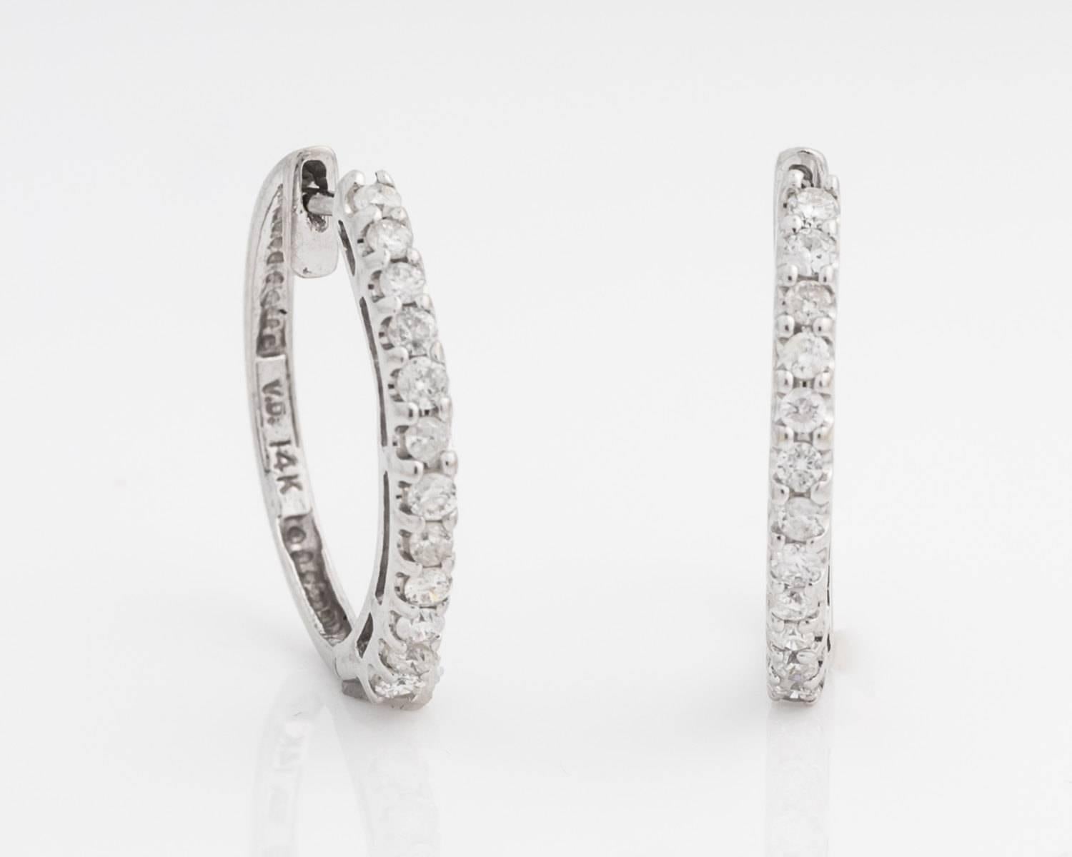 Brand New Diamond and White Gold Hoop Earrings
0.50 Carat Total Weight of Diamonds, G Color, I1 Clarity
One Inch Hoop Around Ear Lobe when worn 
Diamonds placed in Four-Prong Frames with Large U-Shaped Design between Each Prong
Crafted in 14 Karat