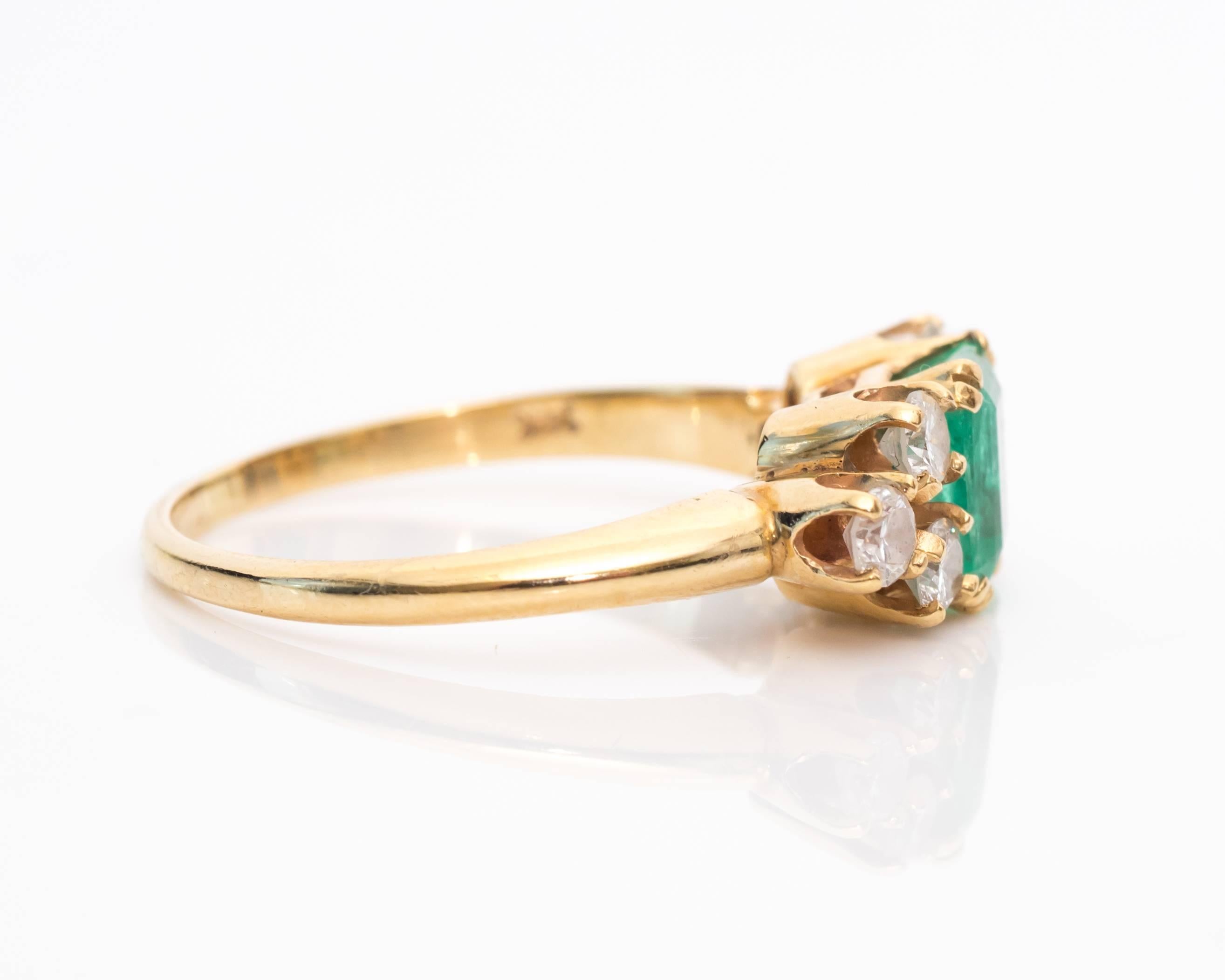 Gorgeous Colombian Emerald and Diamond Ring
Natural Colombian Emerald, only treated with oils.
Original Birthmarks and Fractures still visible in the Emerald 
Mounted in Four-Prong Set 
Six Additional Accent Diamonds, Also mounted in Four-Prong